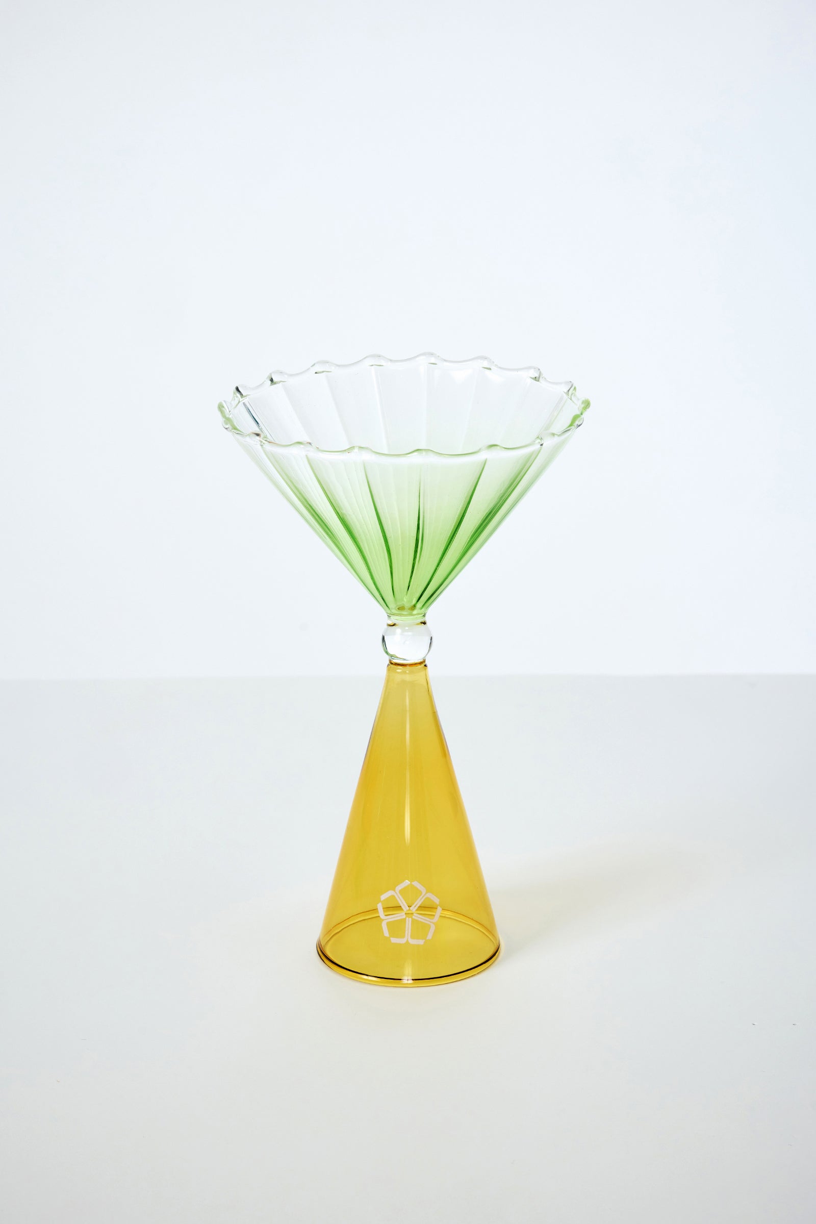 The Cocktail Glass Set with Silicone Floret Mold features a decorative glass vessel with a conical yellow base and a fluted, green-tinted transparent bowl, displayed against a plain white background.