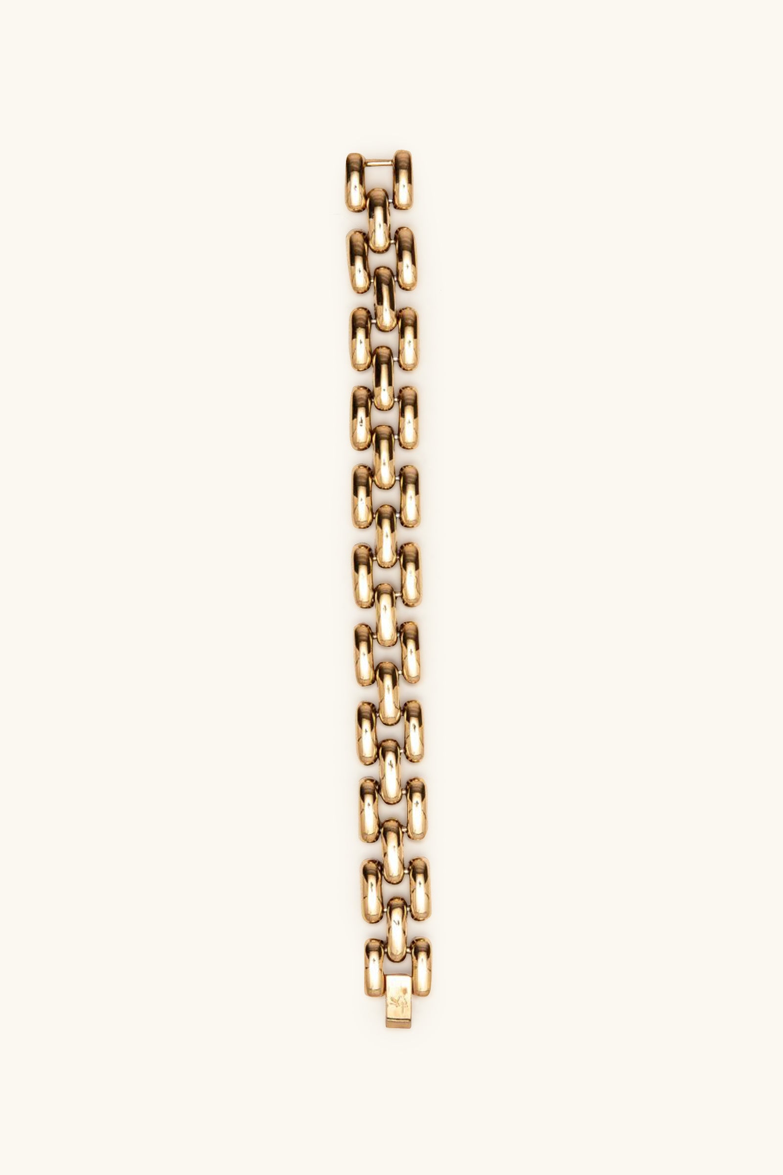 The Phoebe Bracelet is a gold chain-link accessory with a bold, chunky design, showcased vertically against a plain light backdrop.
