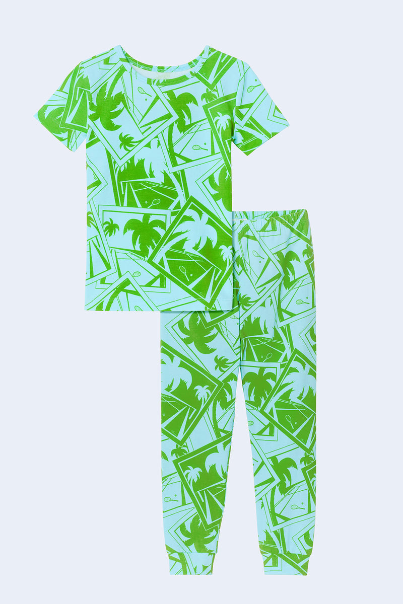The Blue Kids PJ Set - Tennis Stretch Jersey is a matching short-sleeve pajama set in stretch jersey, featuring a T-shirt and long pants with elastic cuffs.