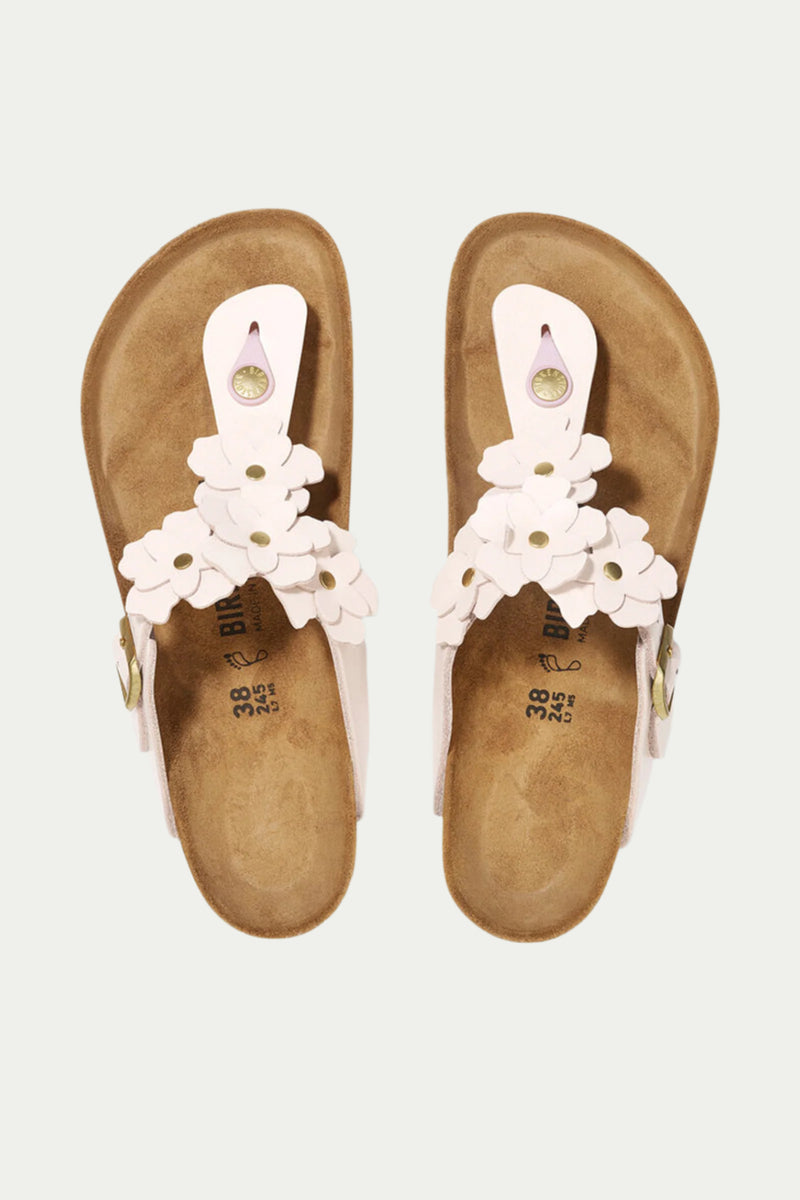 The Womens Gizeh Flowers Leather Sandal - Rose features white straps and flower decorations, displayed from above on a plain background.