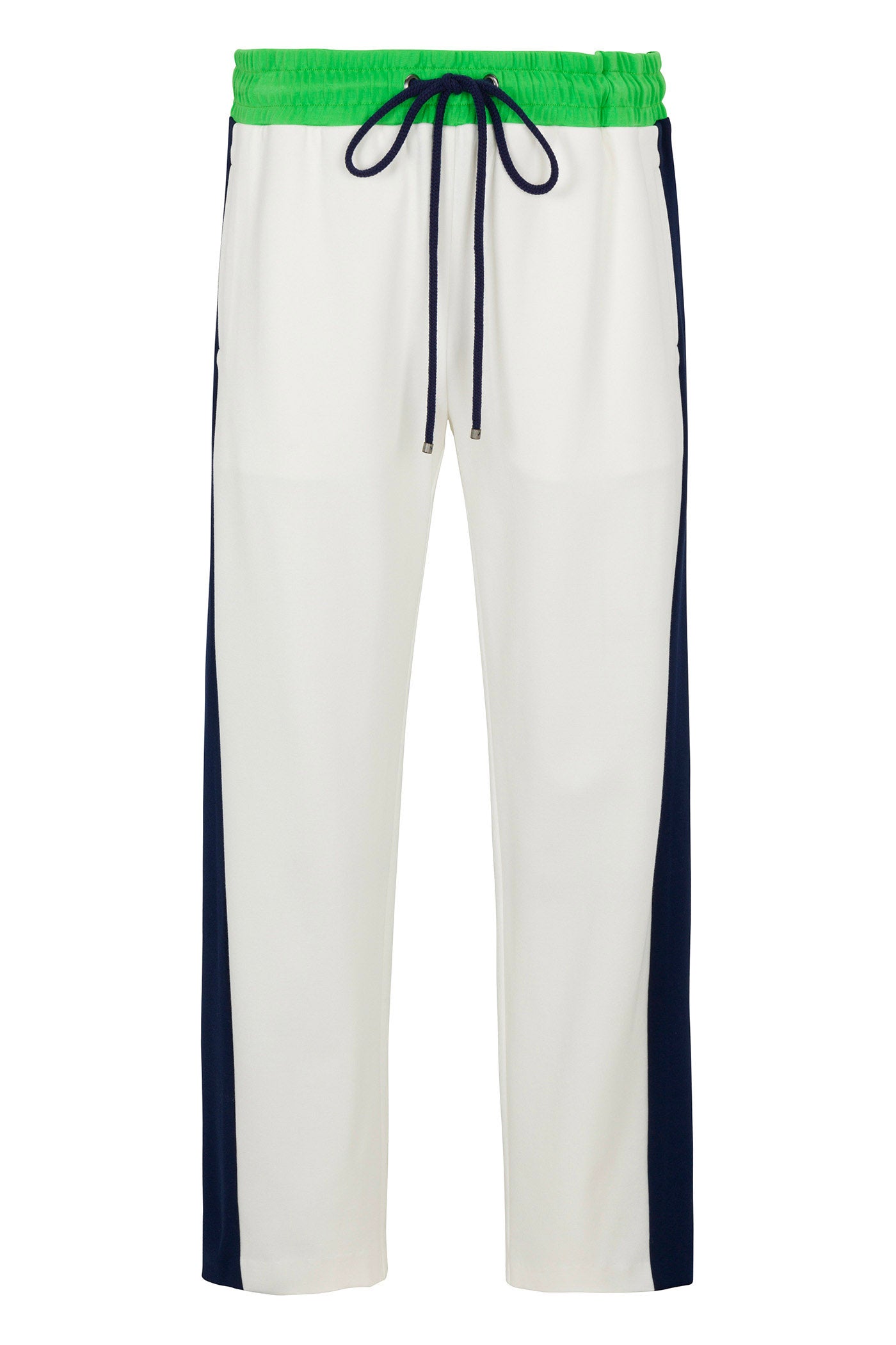 The Tennis Track Pant - Cozy Ponte features white fabric with navy blue side panels, a bright green elastic waistband, and a black drawstring.