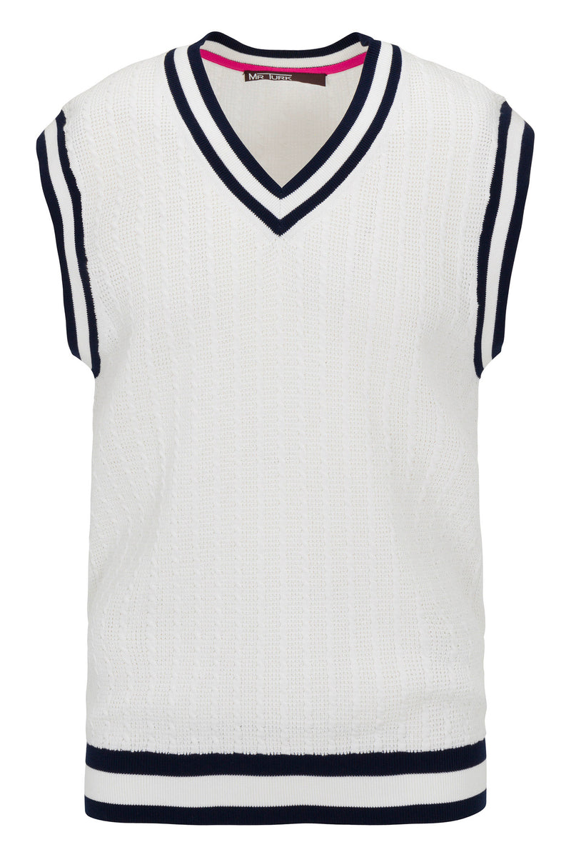 The Matthew V-Neck Knit Vest is a white sleeveless sweater vest with navy blue and black stripes on the collar, armholes, and hem.