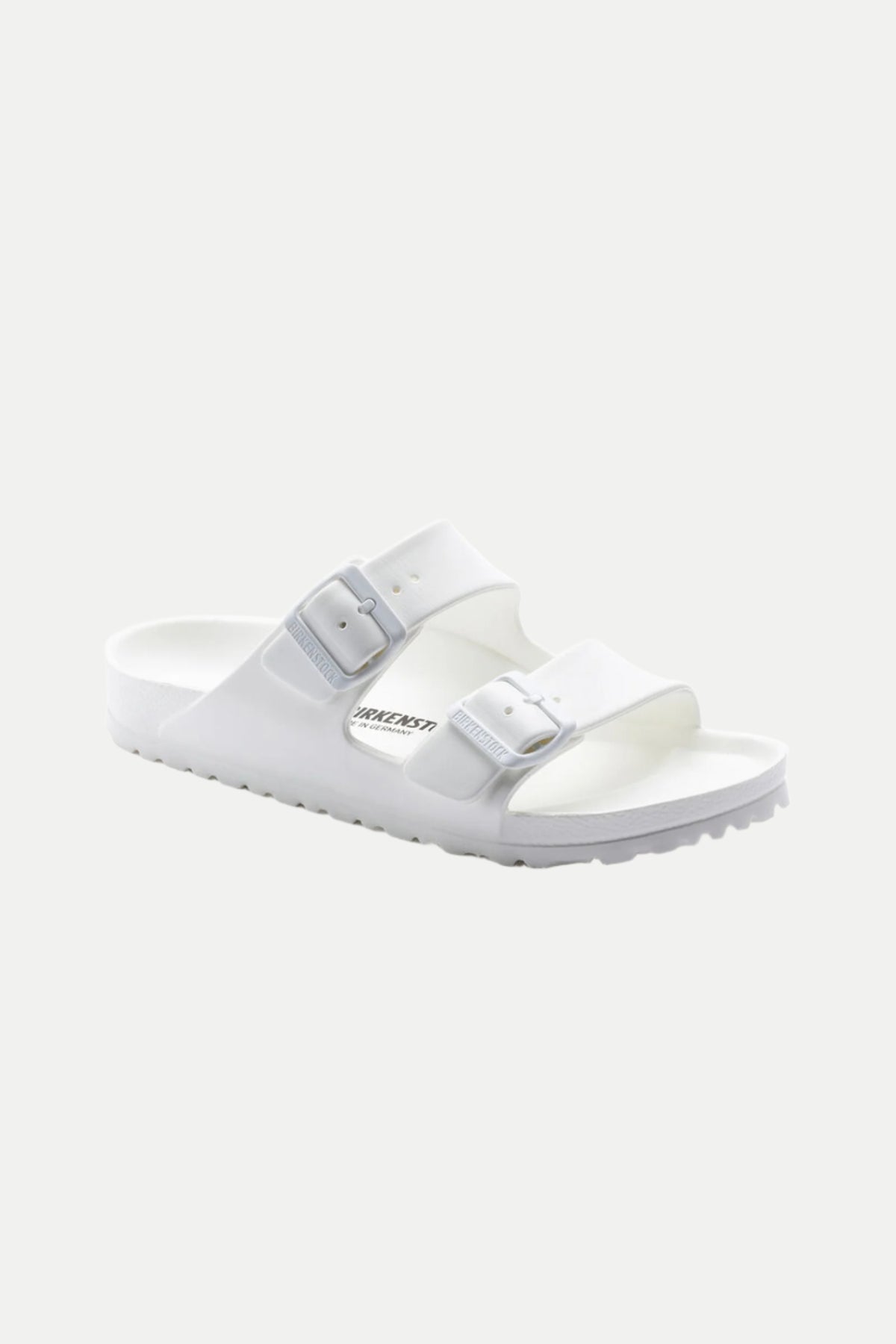 The Mens Arizona White Eva Slide Sandal is shown at an angle on a plain light background, featuring two adjustable buckle straps, a contoured footbed, and the Birkenstock logo on the side.