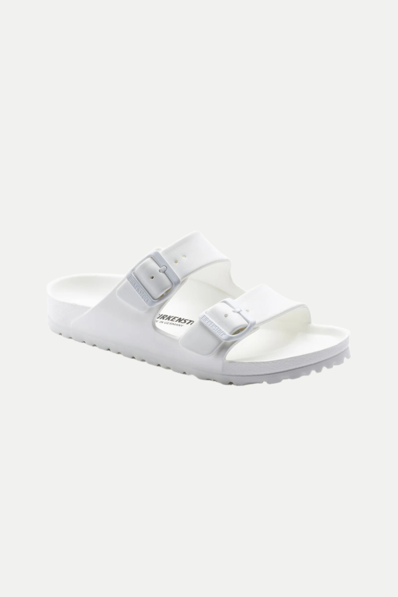 The Mens Arizona White Eva Slide Sandal is shown at an angle on a plain light background, featuring two adjustable buckle straps, a contoured footbed, and the Birkenstock logo on the side.