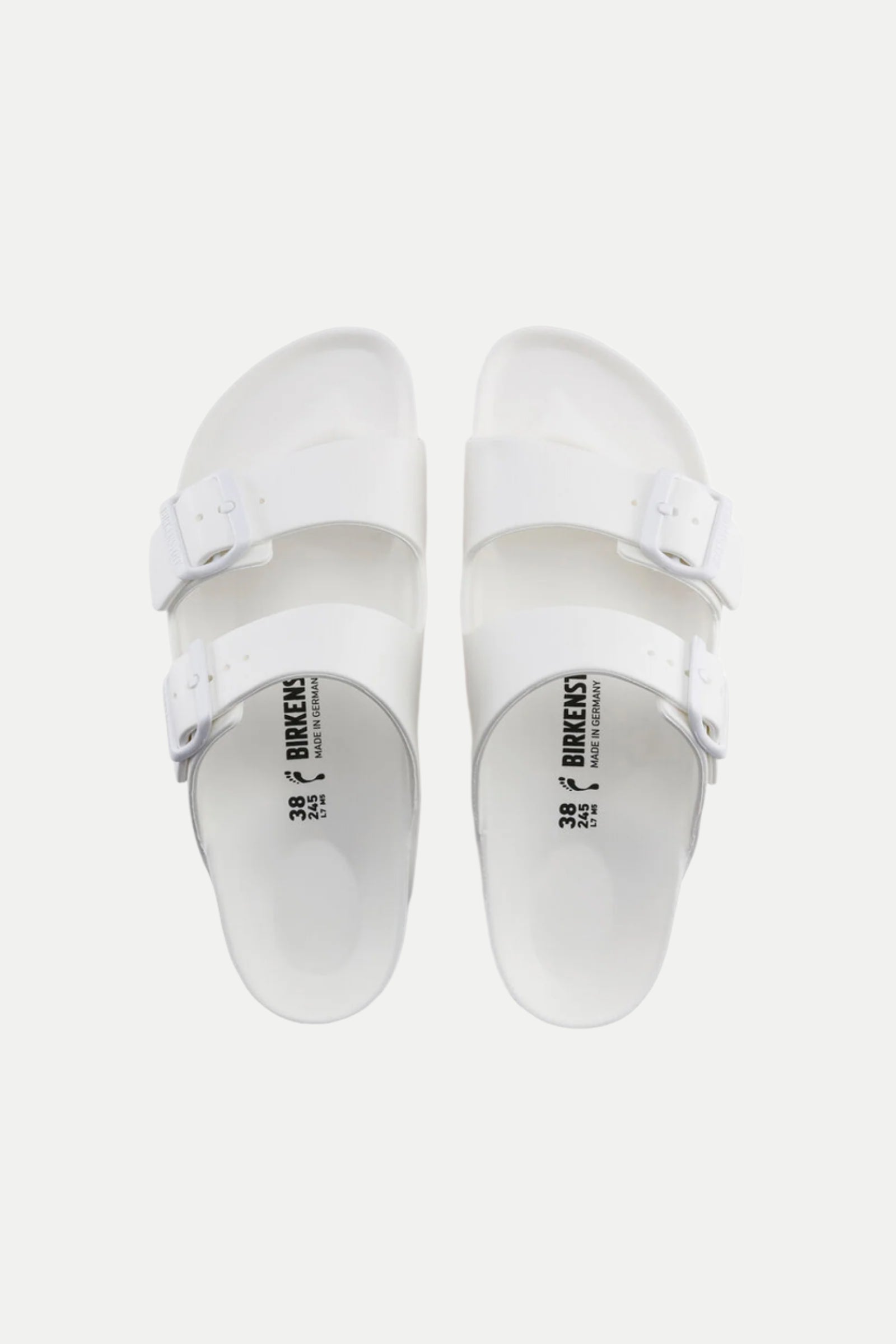 A pair of Mens Arizona White Eva Slide Sandals with two adjustable buckle straps on each shoe, viewed from above against a plain white background.