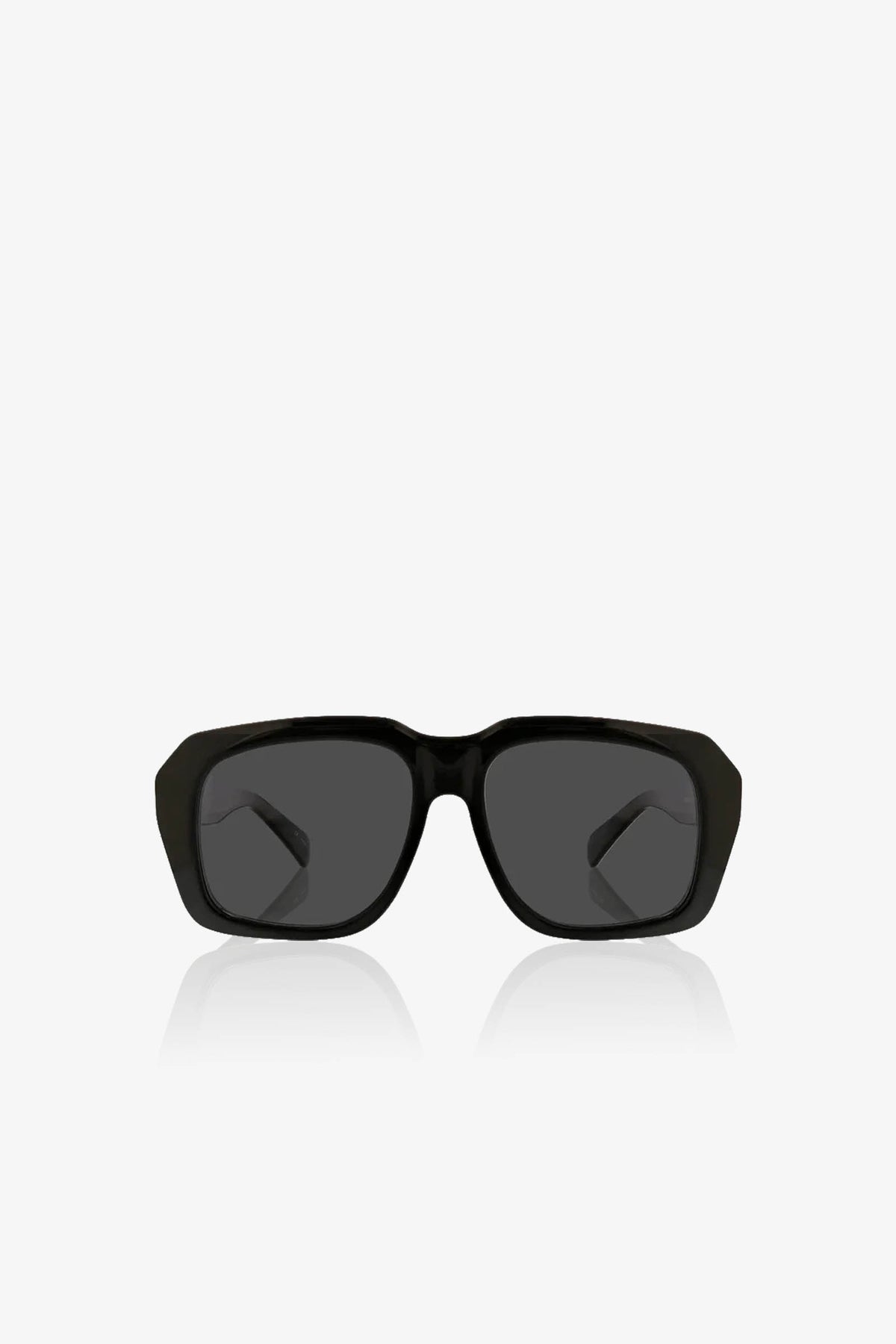 The Andros Sunglass, featuring a black rectangular frame with dark lenses, is centered on a plain white background and shown from the front, with its arms slightly visible behind the lenses.
