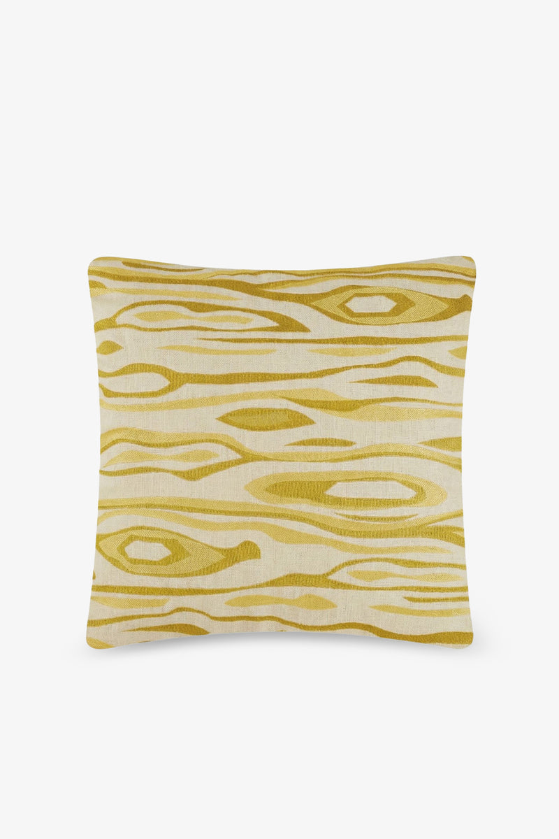 Monterey Embroidered Square Pillow featuring a cream background and a yellow abstract woodgrain pattern with wavy, irregular horizontal lines and oval shapes. The pillow is displayed on a plain white background.
