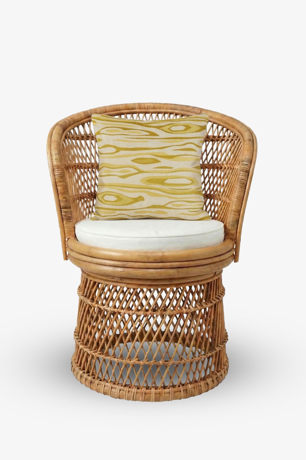 A wicker chair with a round seat, white cushion, and a decorative Monterey Embroidered Square Pillow featuring a yellow pattern, set against a plain white background.