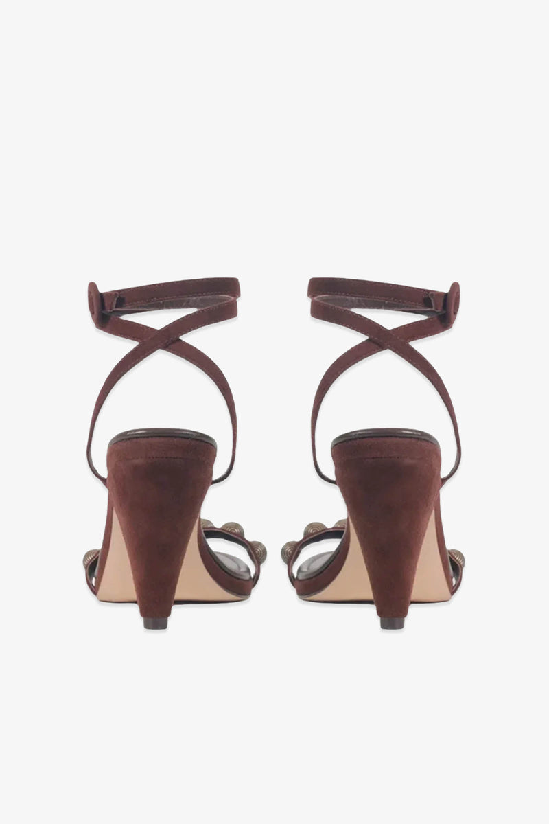 A pair of Paula Torres Espanha Sandal heeled sandals in brown, seen from the back, showcasing crisscross ankle straps and a cushioned insole on sturdy block heels.