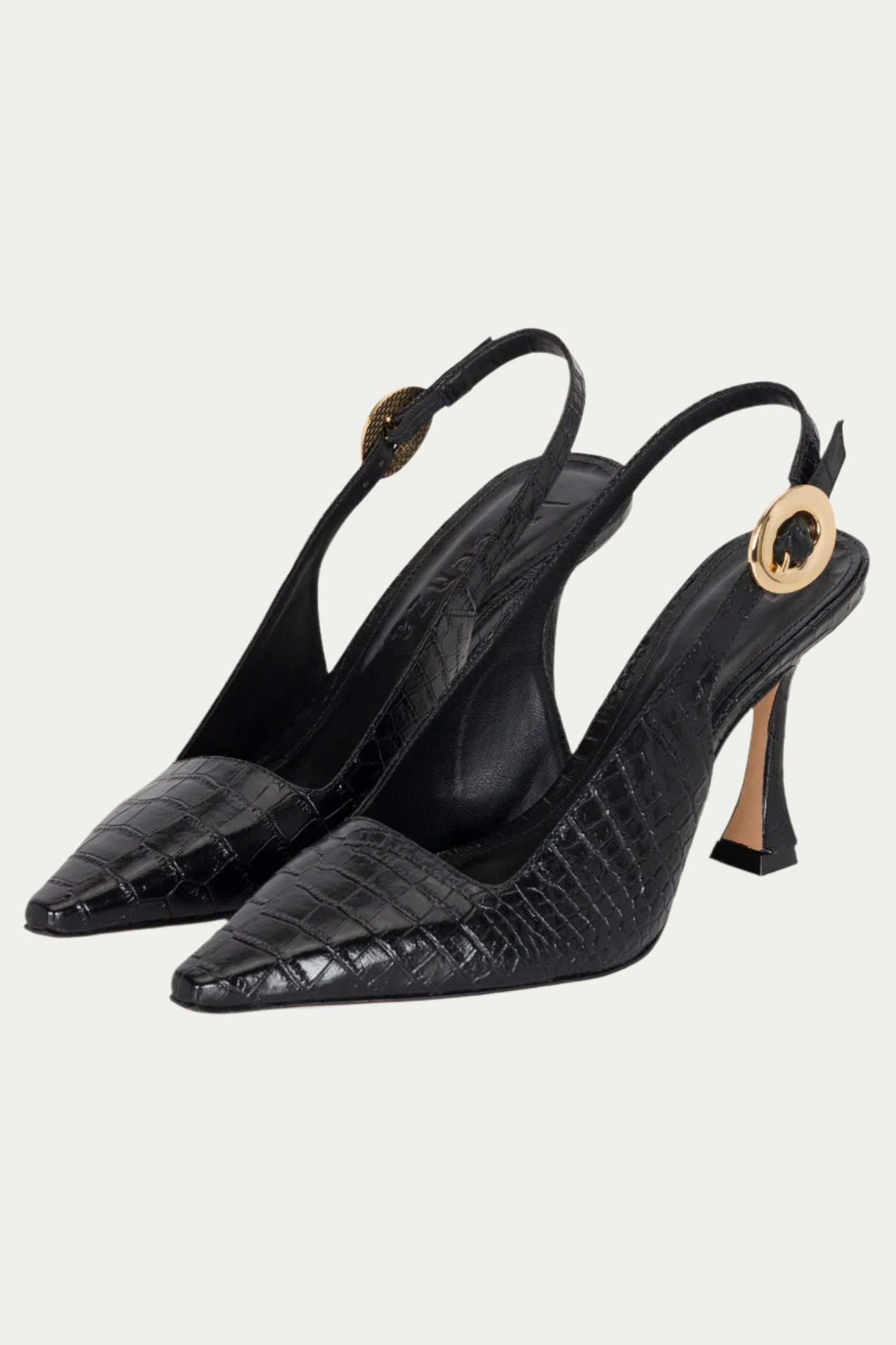 The Naomi Slingback Heel is a pair of black, crocodile-textured heels with pointed toes, sculpted heels, and gold circular buckles on the ankle straps.