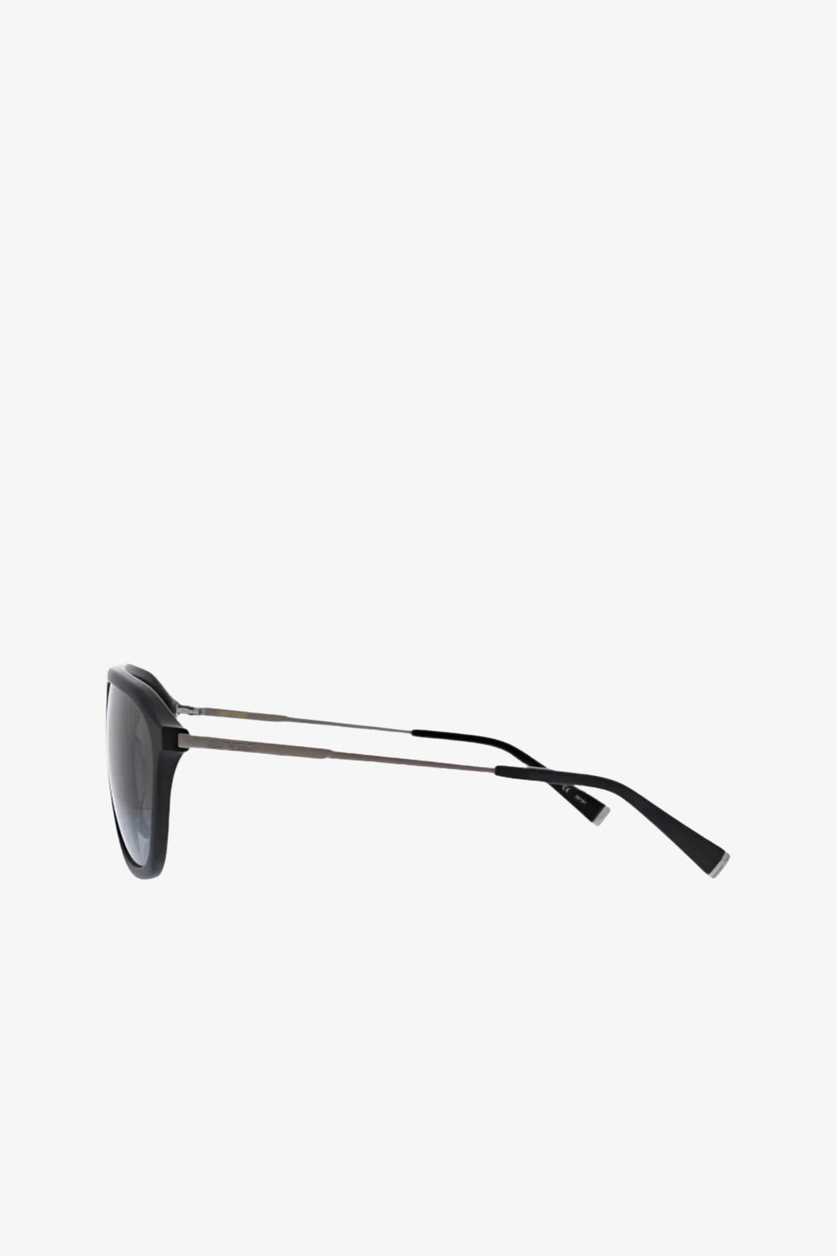 Side view of Stern Sunglass in black aviator style, featuring thin silver metal arms and dark UV-protective lenses, set against a plain white background.