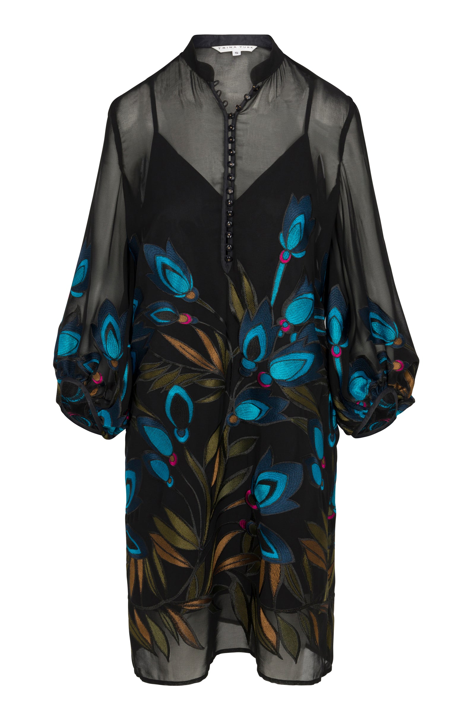 The Boheme 2 Dress is a sheer black tunic with a buttoned neckline, vibrant blue and teal floral embroidery, loose three-quarter sleeves, and comes with a black slip underneath.