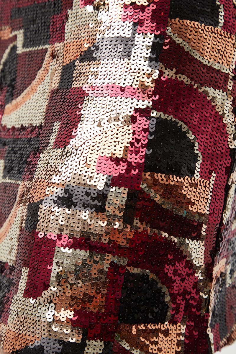 Close-up of the Rico Galerie Arte Sequin Mini Skirt, featuring black, red, gold, bronze, and cream sequins in an abstract geometric pattern for a shiny, textured look.