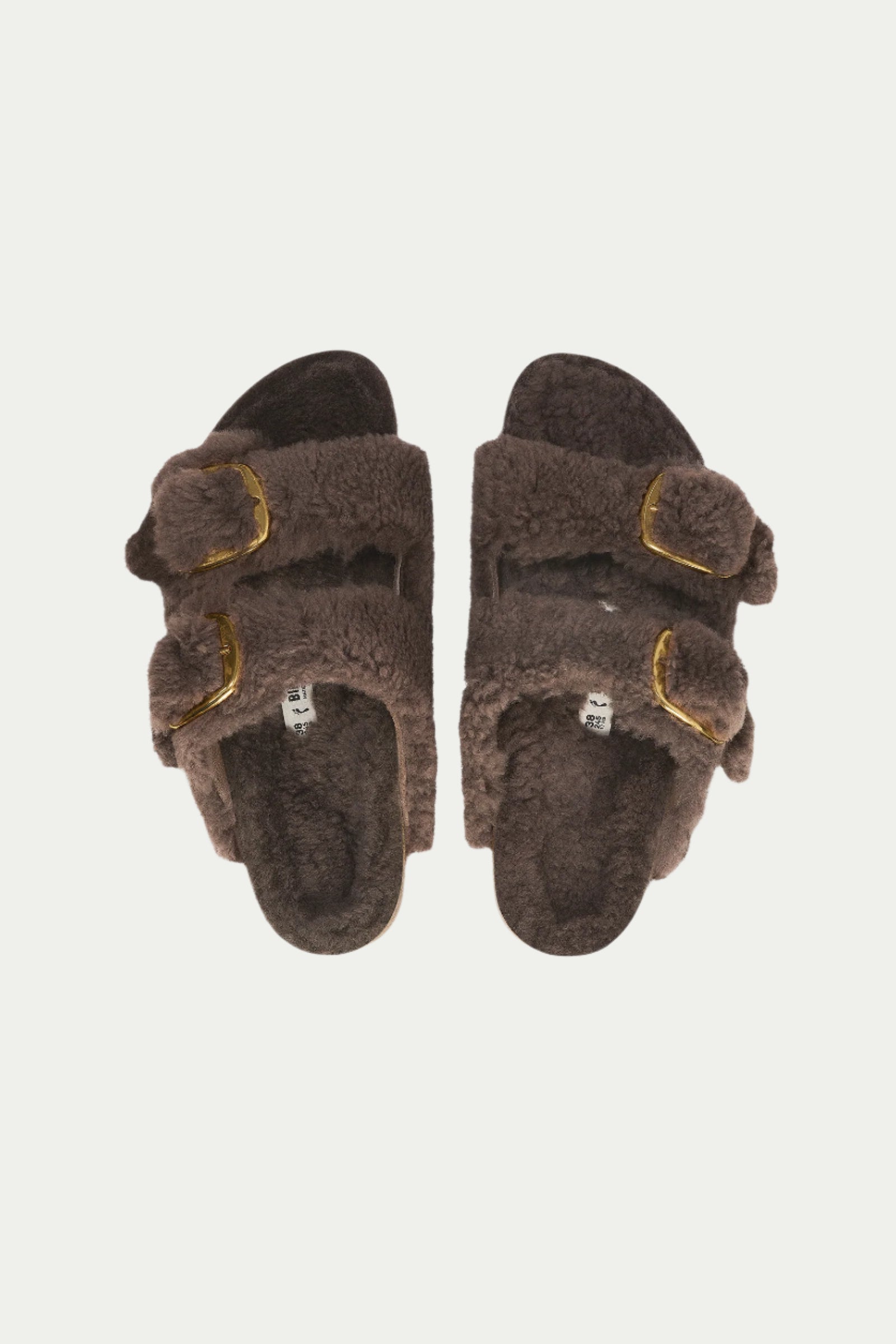 A pair of Womens Arizona Big Buckle Teddy Grey Birkenstock Sandals with two straps and gold buckles, seen from above on a plain white background.