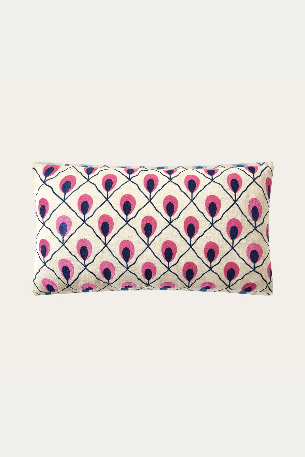 The Roseville Embroidered Throw Pillow - Multi features a cream background with a repeating diamond grid of stylized pink and dark blue peacock feathers.