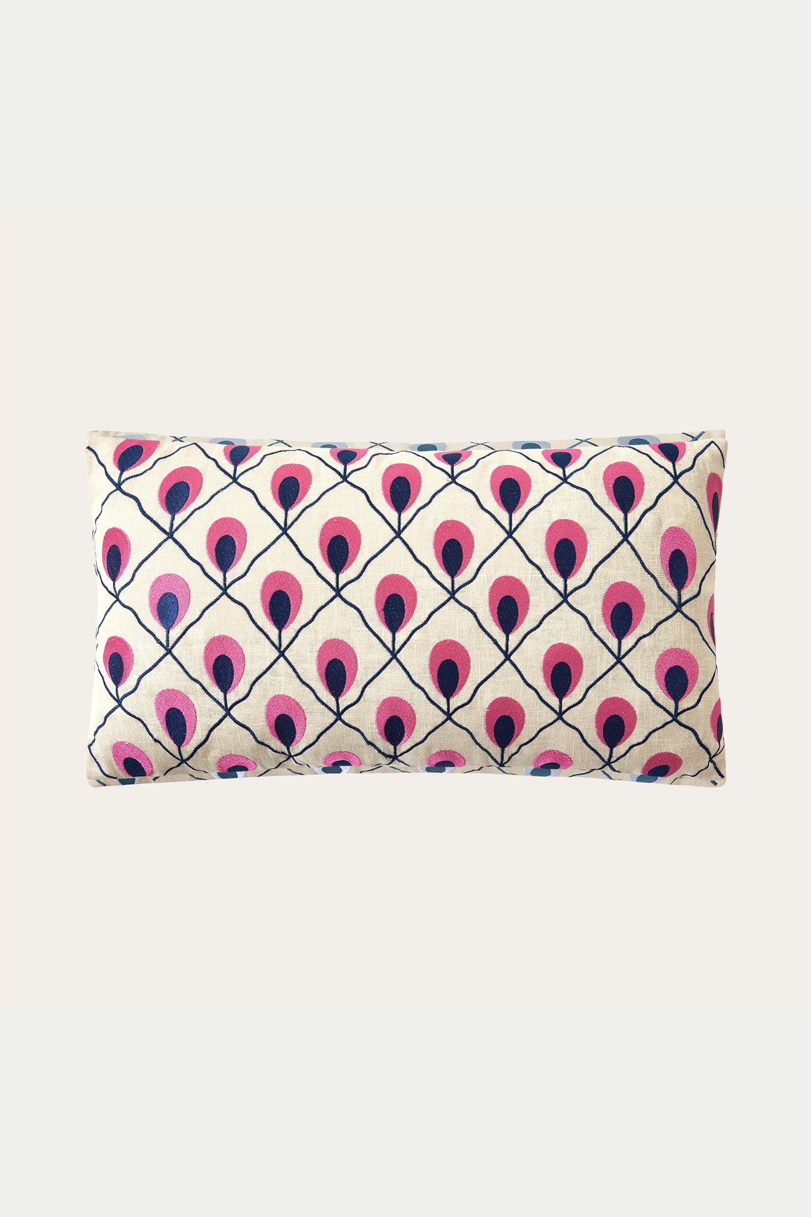 The Roseville Embroidered Throw Pillow - Multi features a cream background with a repeating diamond grid of stylized pink and dark blue peacock feathers.