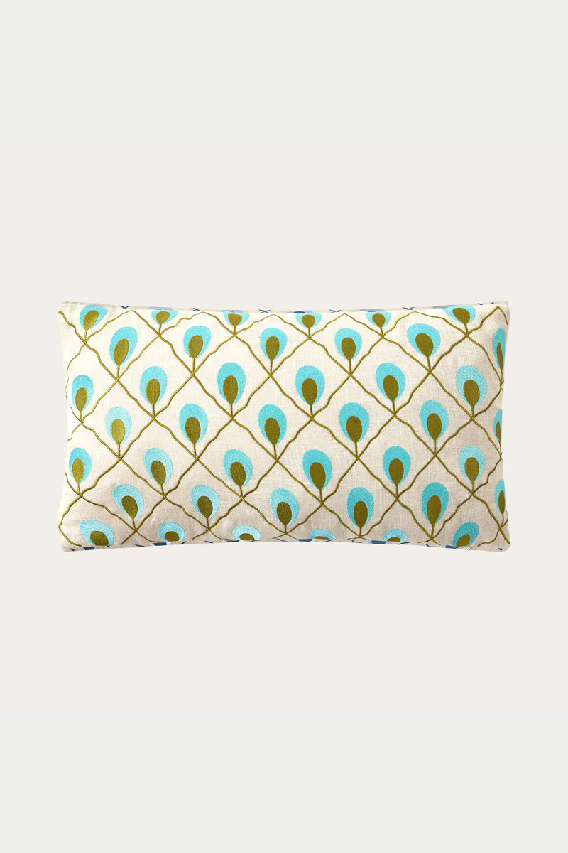 The Roseville Embroidered Throw Pillow - Blue showcases a white background with blue and green peacock feather motifs arranged in a diamond grid.