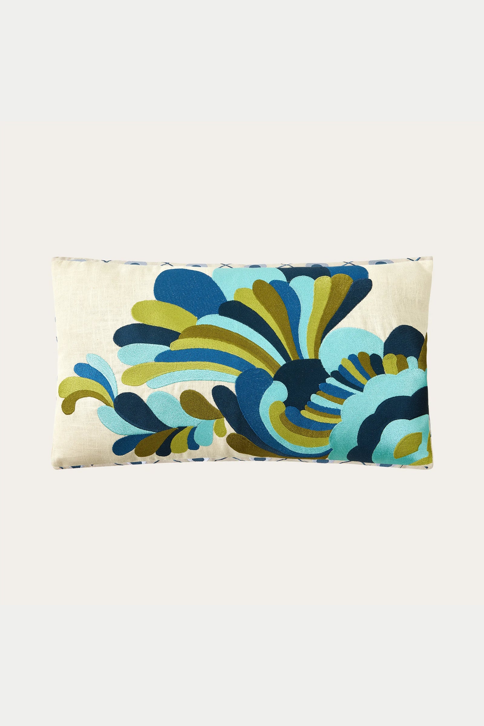 The Escondido Embroidered Throw Pillow - Blue features a cream background with an abstract, colorful leaf-inspired pattern in blue, teal, green, and black.