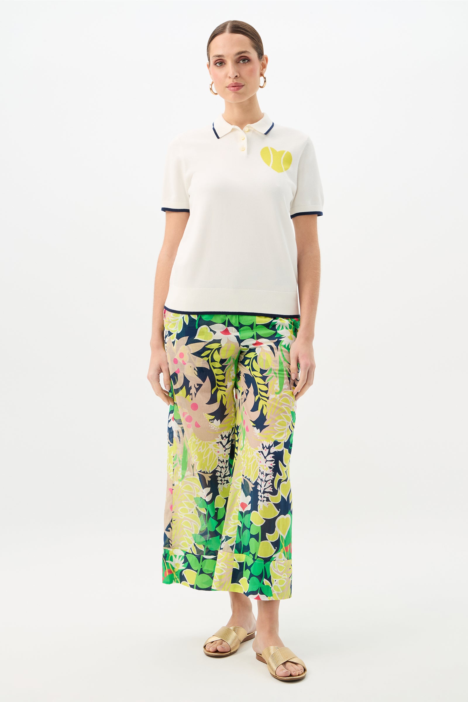 A woman wearing the Serena Tennis Heart Short-Sleeve Polo.