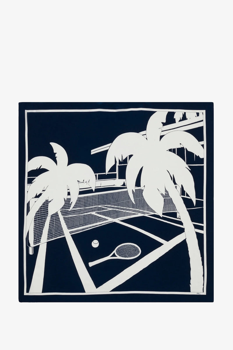 The Tennis Scarf - Silk features a navy and white illustration of a tennis court with a racket, ball, and palm trees, bordered by a crisp white frame.