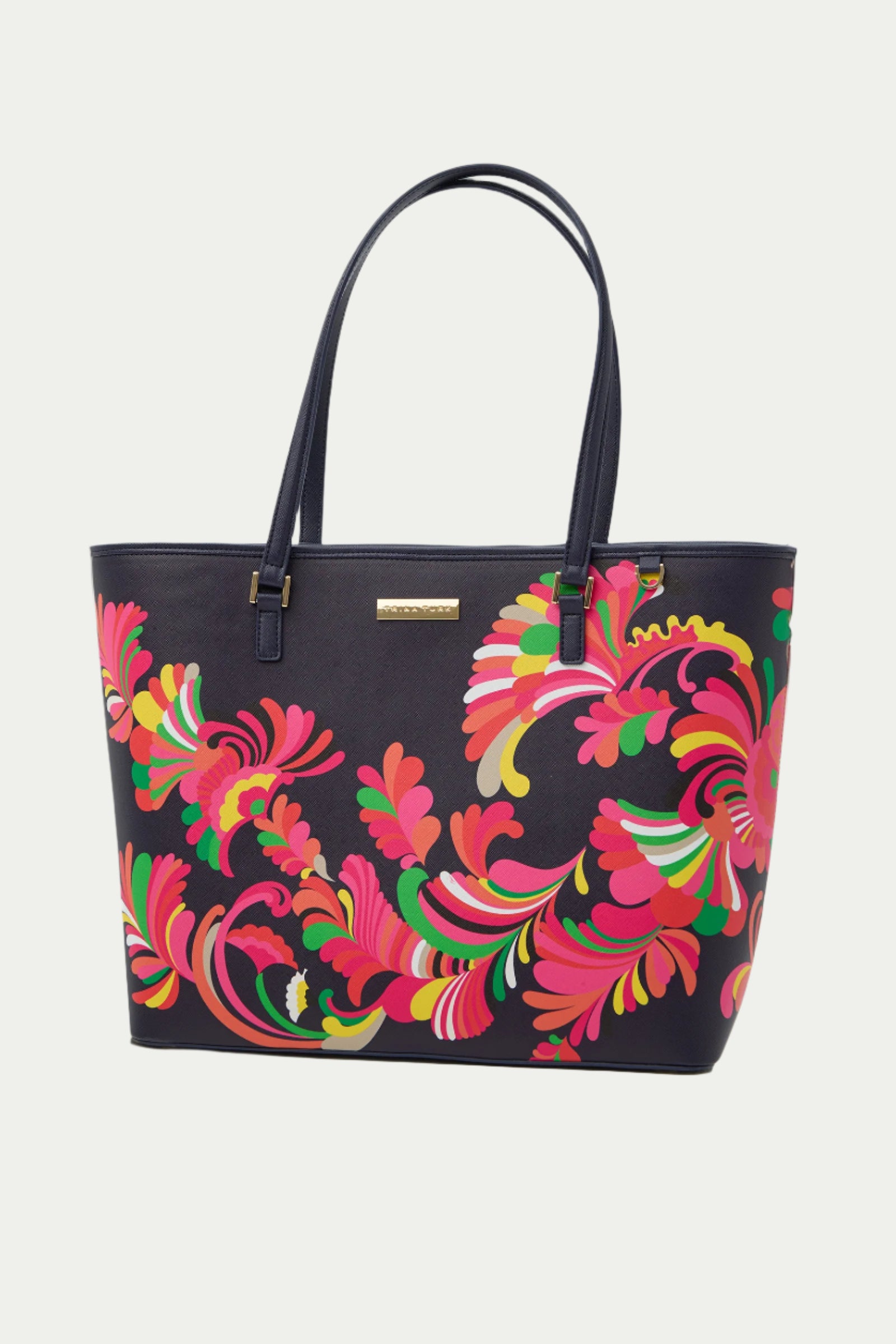 The Saffiano Tote Handbag - Palms Paradise is a multi-colored bag with two handles, featuring a vibrant floral and swirl pattern in pink, red, yellow, and green.