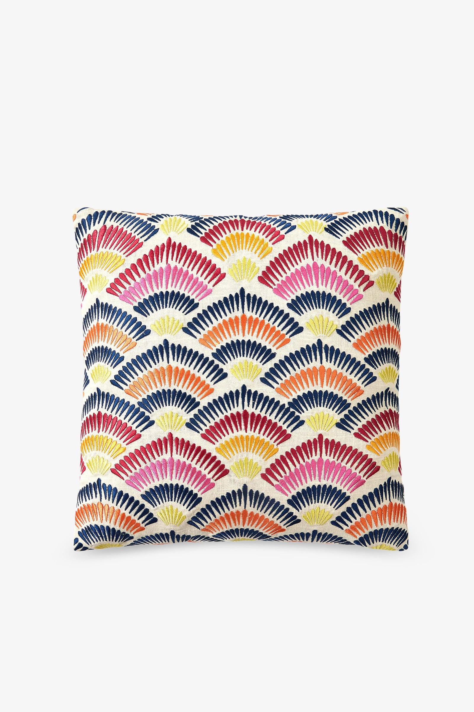 The Embroidered Square Pillow features a geometric fan pattern in red, orange, yellow, and navy blue on a white background.