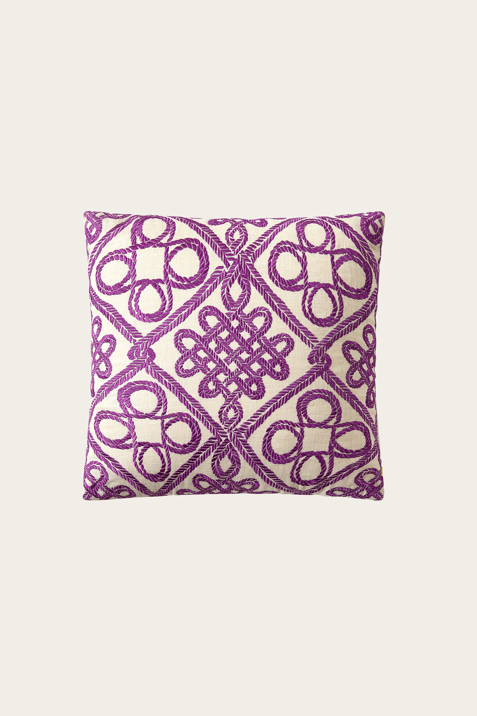 The Costa Mesa Embroidered Euro Throw Pillow features a multi-colored design with bold geometric and circular embroidery, adding texture and decorative flair to any space.