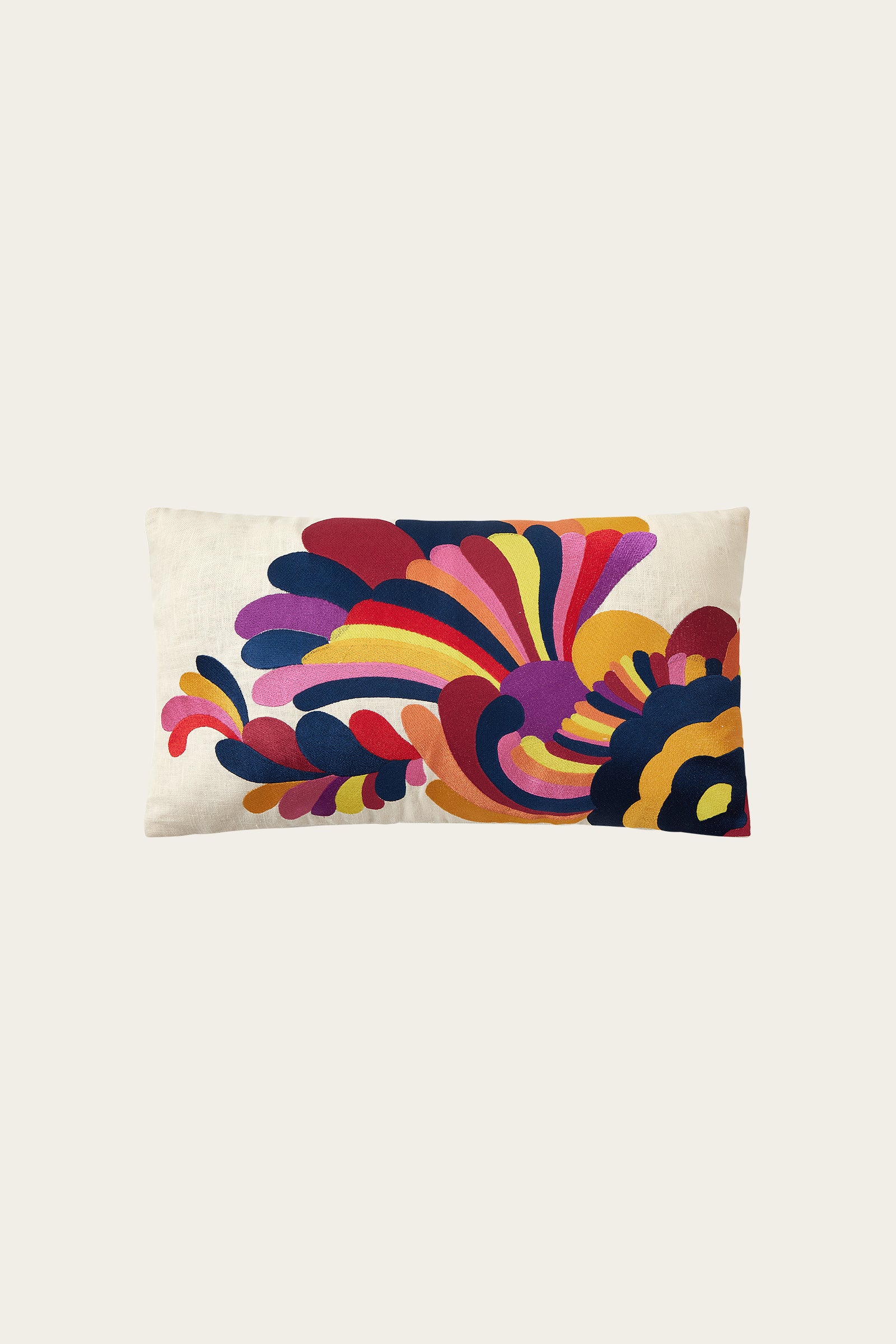 The Escondido Embroidered Throw Pillow in Multi features a rectangular shape and a bold, colorful abstract pattern on a cream background, adding an artistic and vibrant touch to any space.