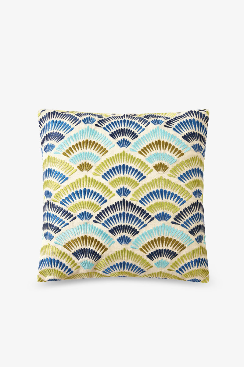 The Pasadena Embroidered Square Pillow features a modern, geometric design of overlapping, fan-shaped semicircles in blue, navy, teal, and yellow on a crisp white background.