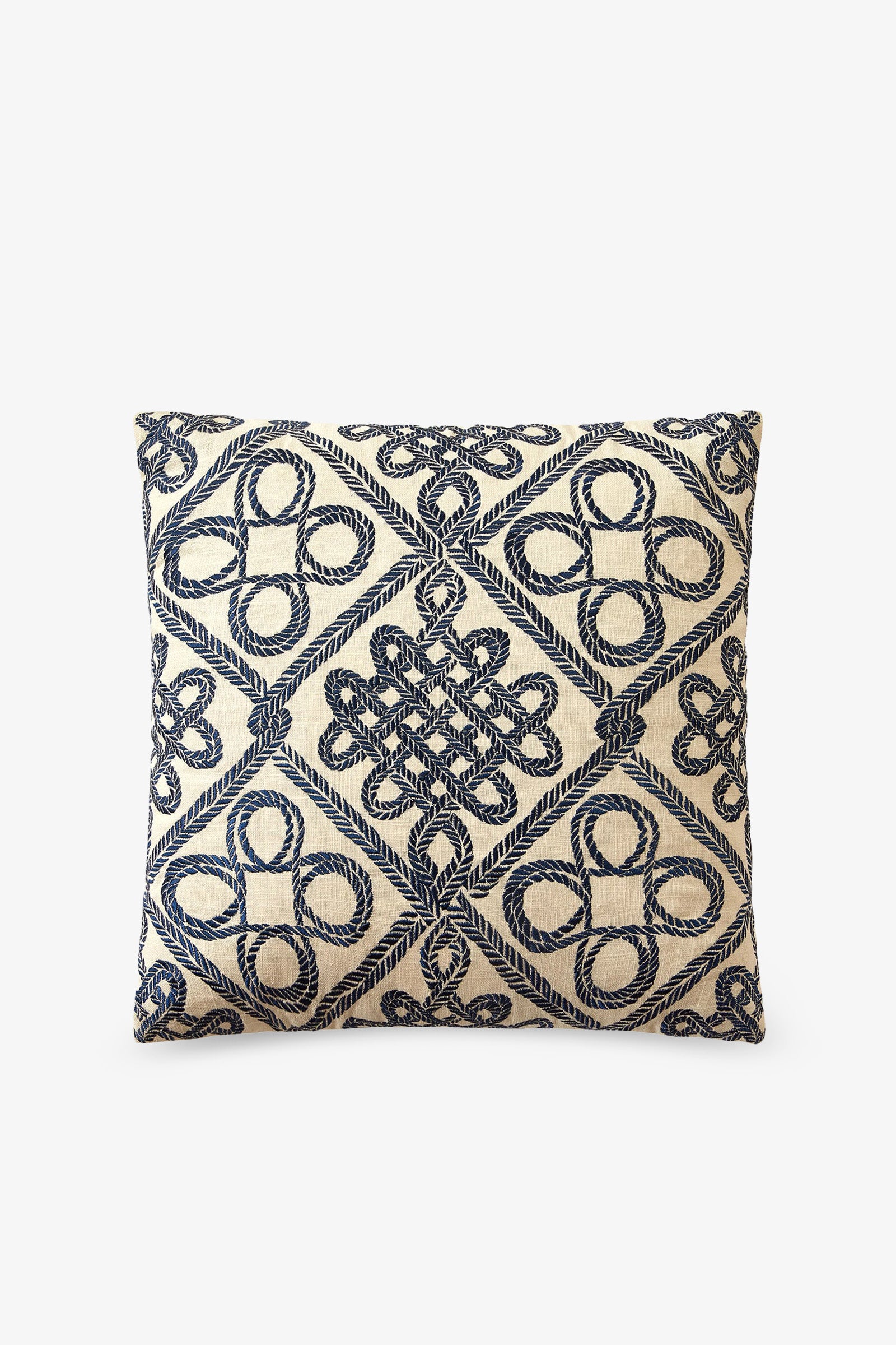 The Costa Mesa Embroidered Square Pillow features a cream background adorned with intricate navy blue embroidered geometric patterns, showcasing symmetrical loops and knots.