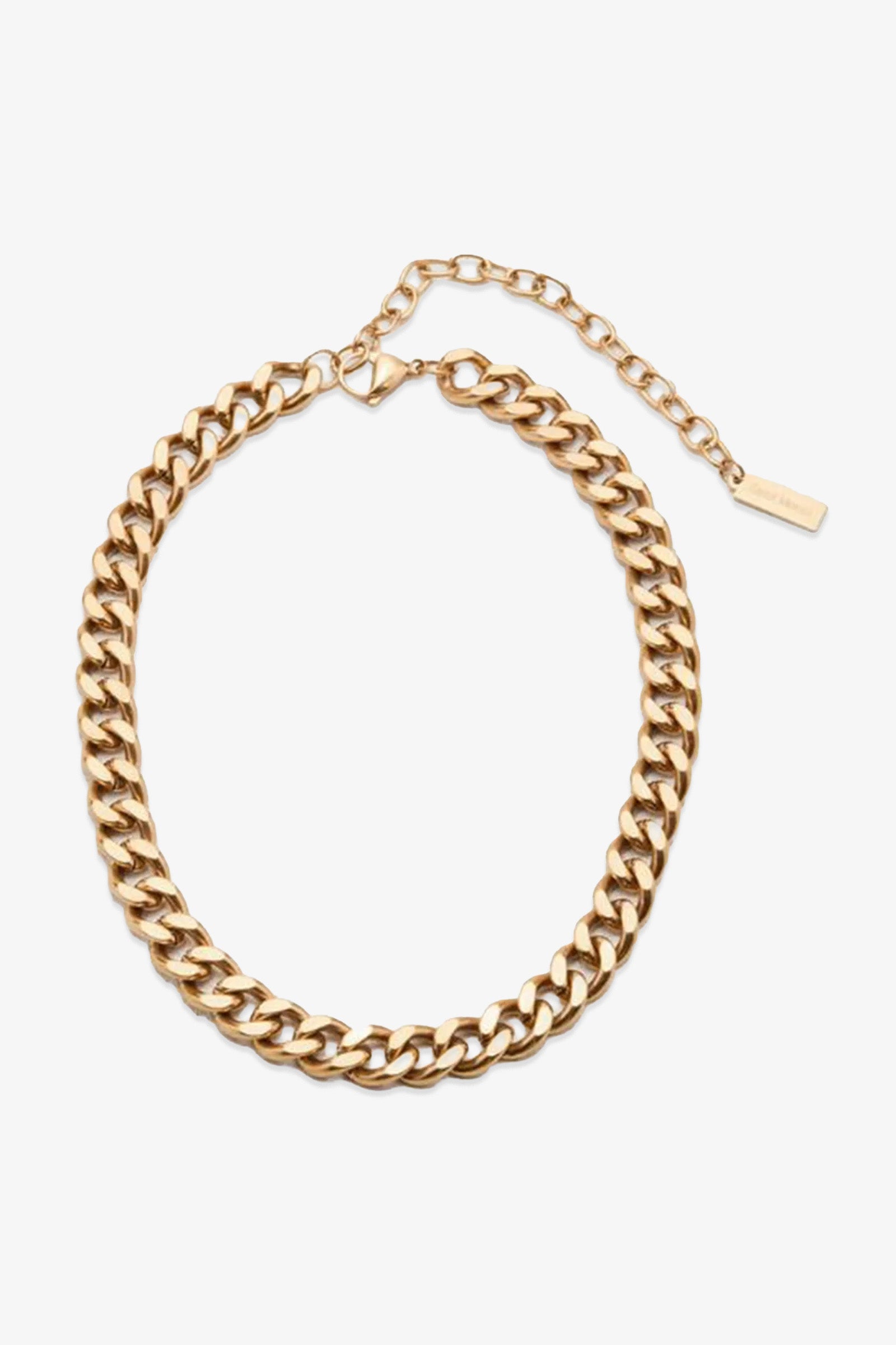 The Alize Necklace features thick, interlocking curb links in gold and includes an adjustable extender with a small rectangular tag at the end, showcased against a white background.