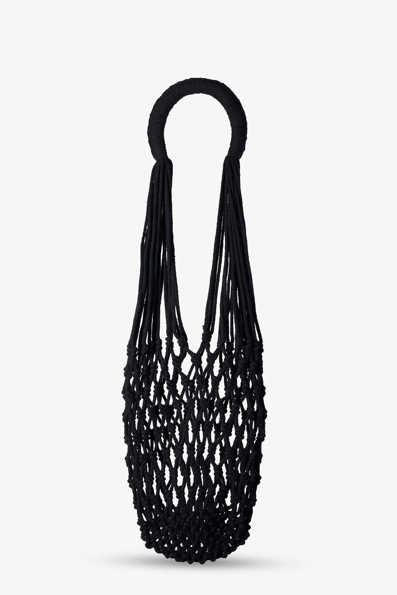 The Nannacay Kim Woven Bag, featuring a black netted design with round handles and crafted from knotted material, is displayed against a plain white background.