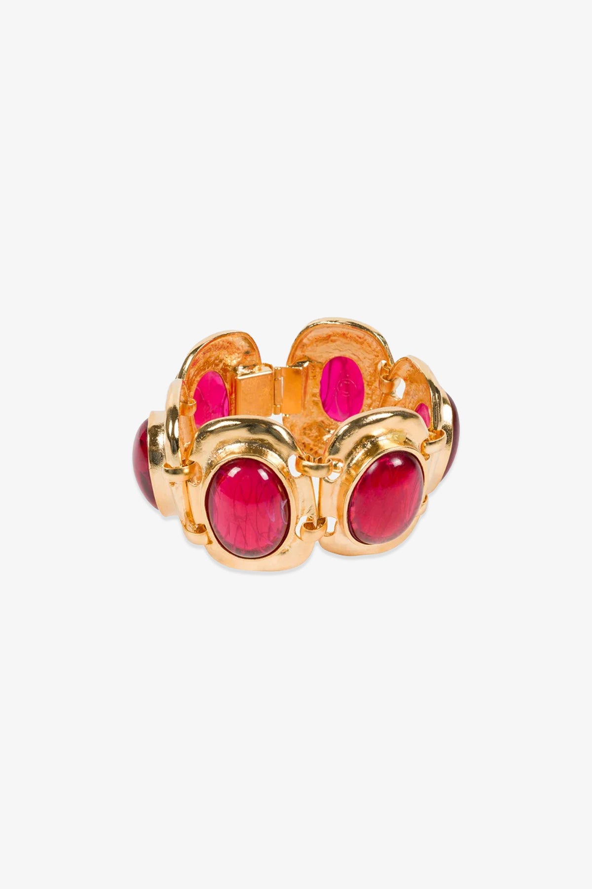 A Ruby Cabachon Bracelet featuring large oval red stones set in rounded bezels, linked together in a bold, vintage-inspired design on a white background.