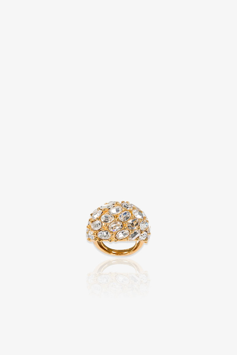 Cluster Stone Dome Ring featuring a rounded gold dome top encrusted with multiple sparkling clear stones, showcased on a white background with a subtle reflection below.