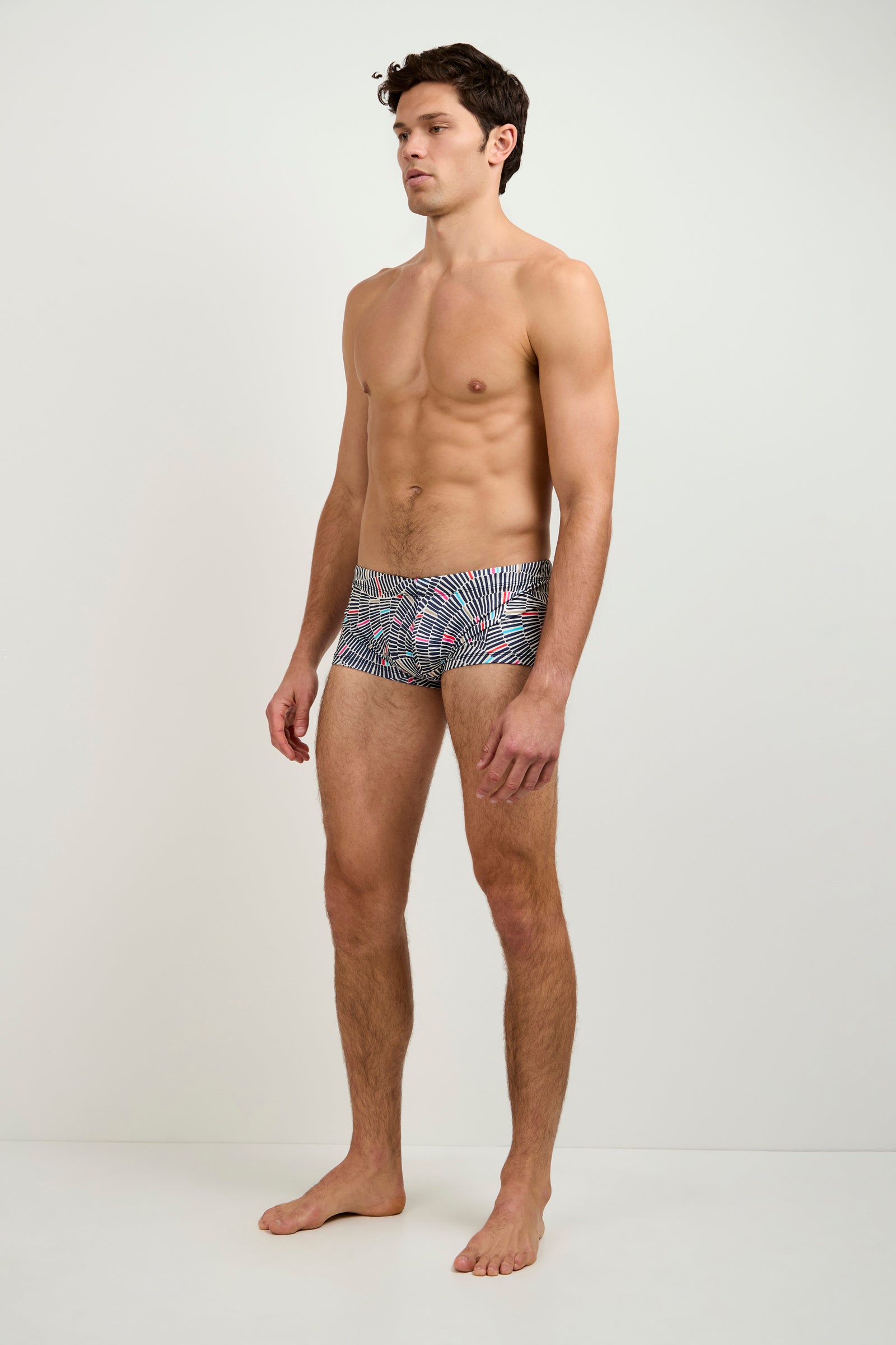 A man wearing the Sorrento Swim Trunk in Java.