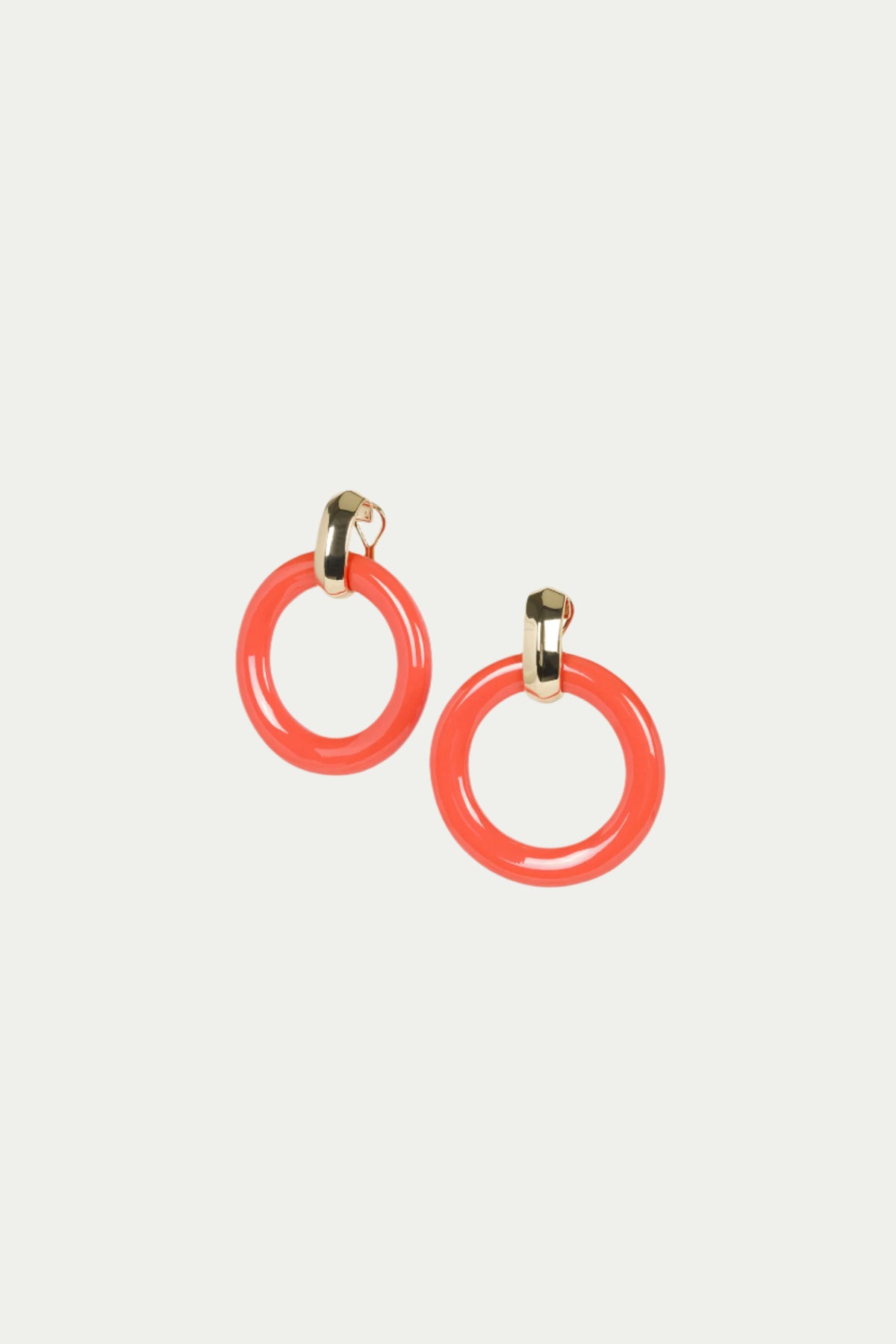TT x KJL Doorknocker Earrings in Coral feature glossy circular hoops and small gold-toned clasps, shown on a plain white background.