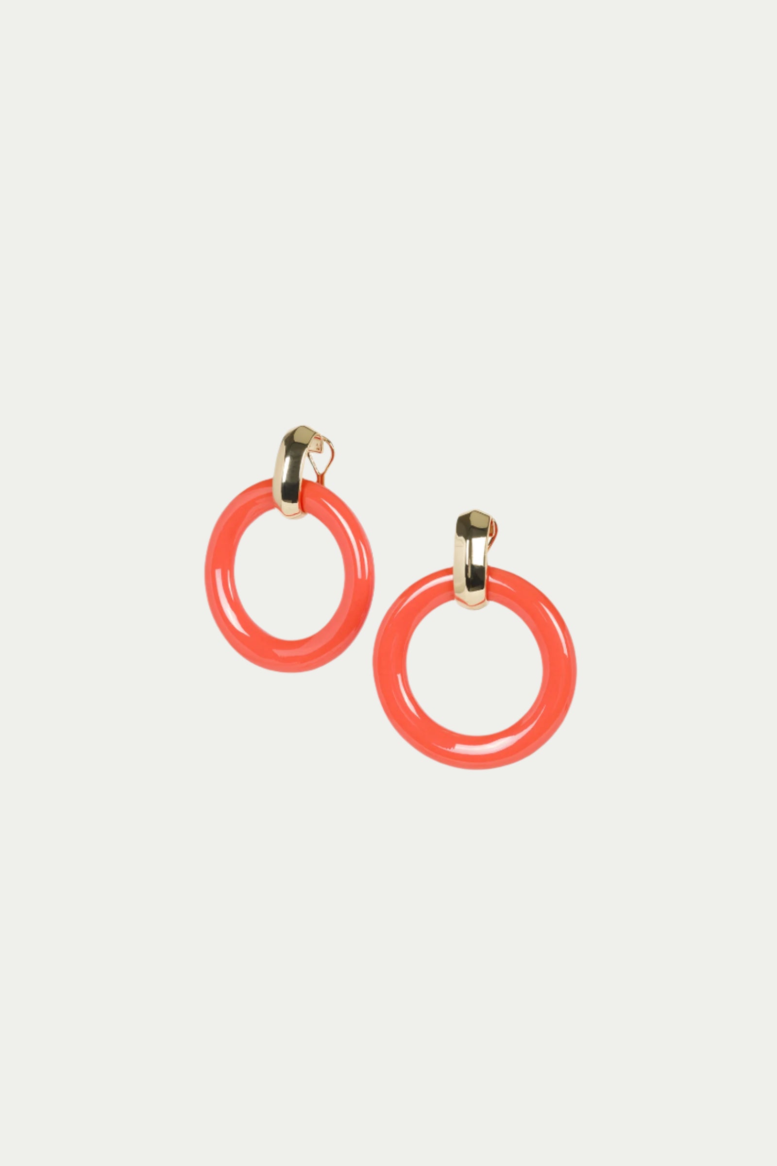 TT x KJL Doorknocker Earrings in Coral feature glossy circular hoops and small gold-toned clasps, shown on a plain white background.
