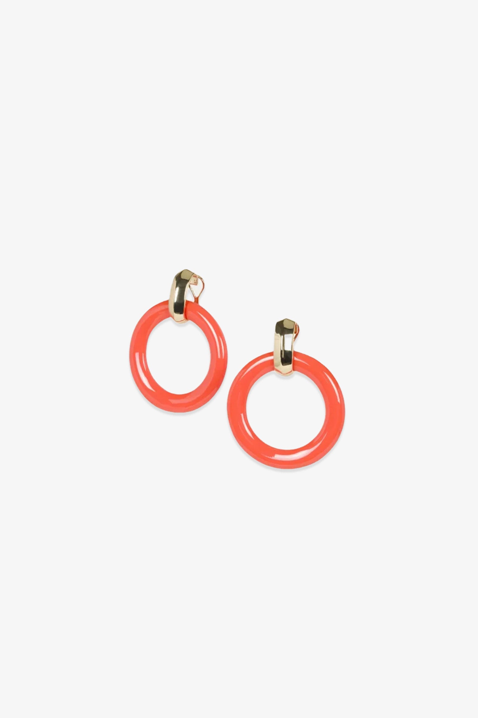 A pair of TT x KJL Doorknocker Earrings in coral, featuring gold-tone studs and circular coral-colored hoops, displayed on a white background.