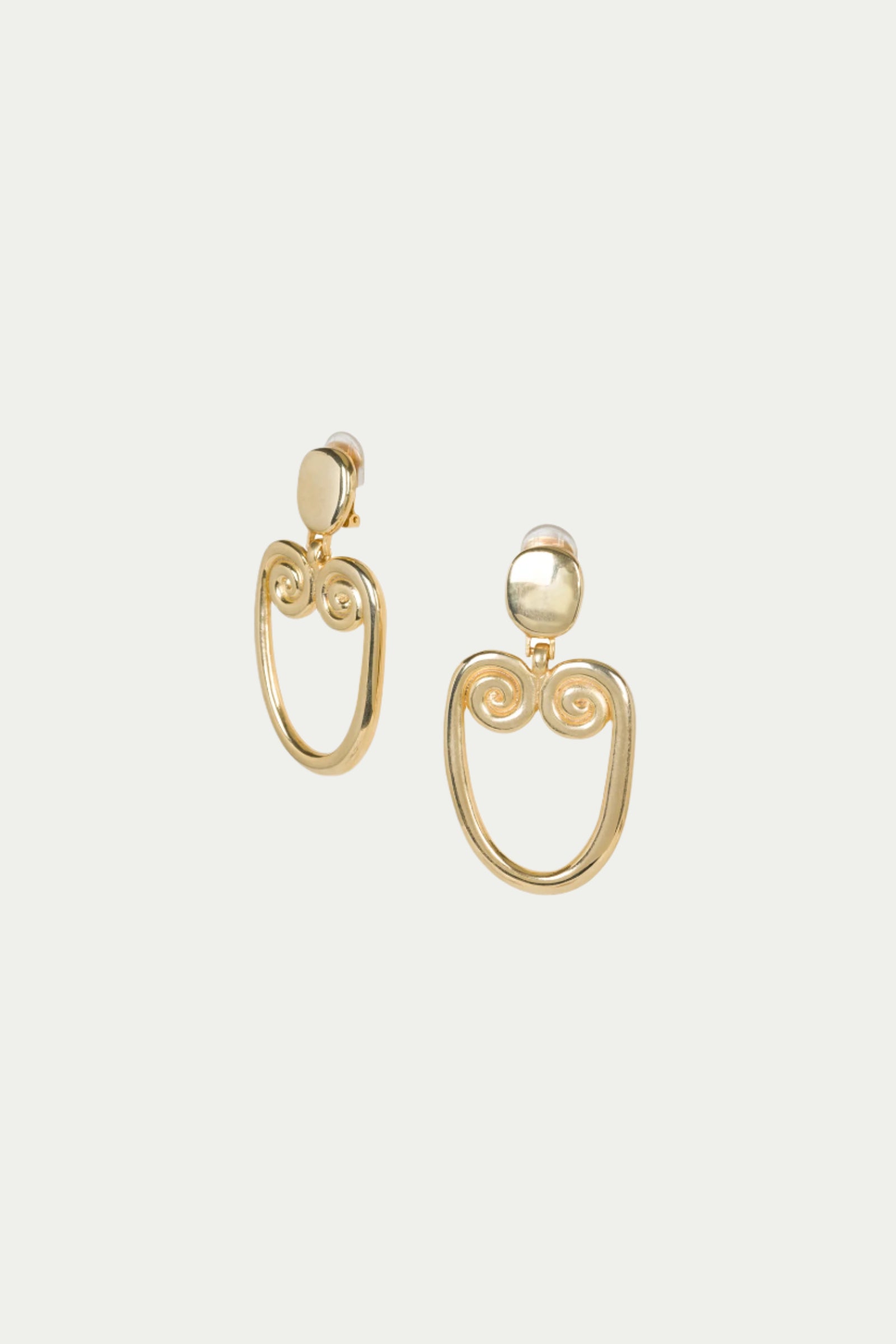 TT x KJL Gold Double Scroll Clip-On Earrings feature gold round studs with open, oval-shaped dangles and decorative spiral details at the top.