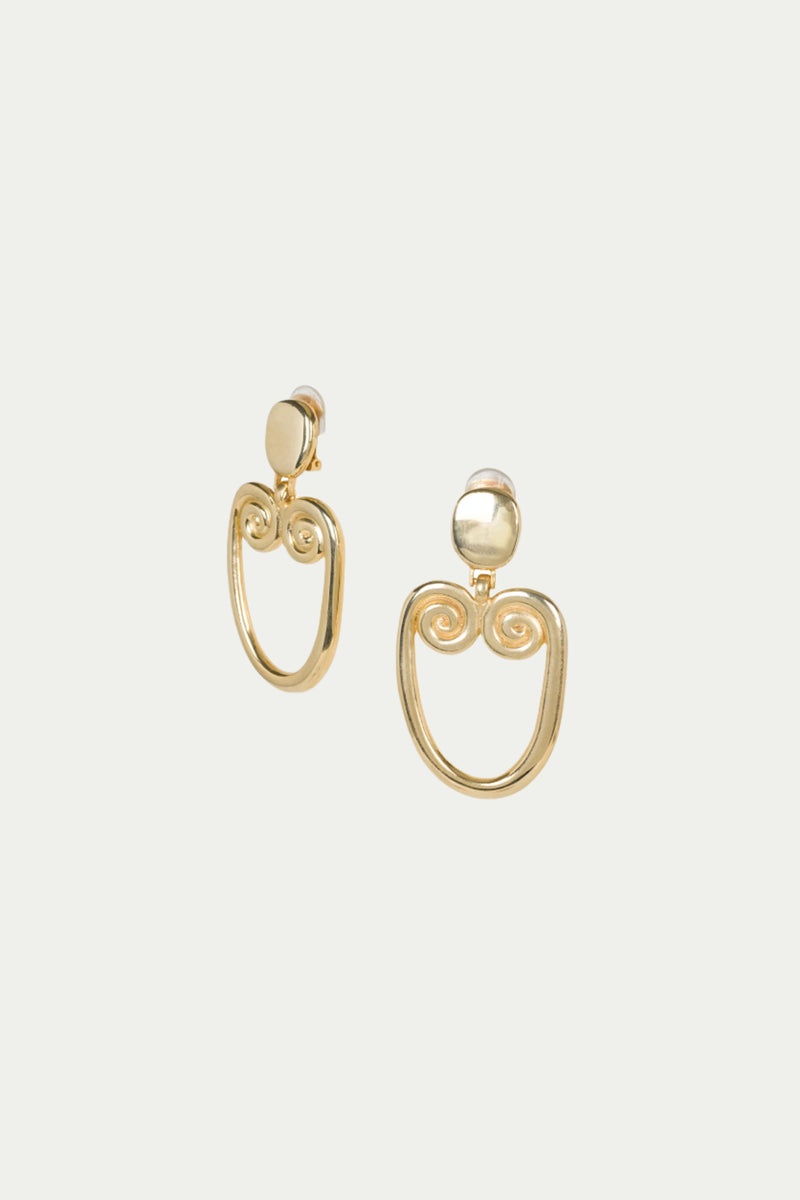 TT x KJL Gold Double Scroll Clip-On Earrings feature gold round studs with open, oval-shaped dangles and decorative spiral details at the top.