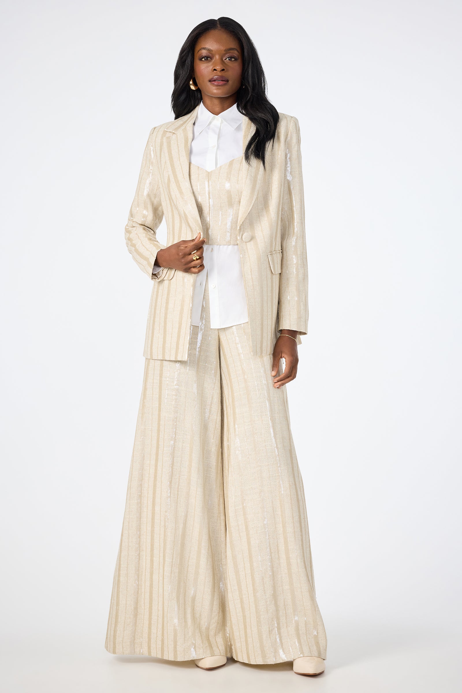 A woman wearing the Alternates 2 Blazer in white.