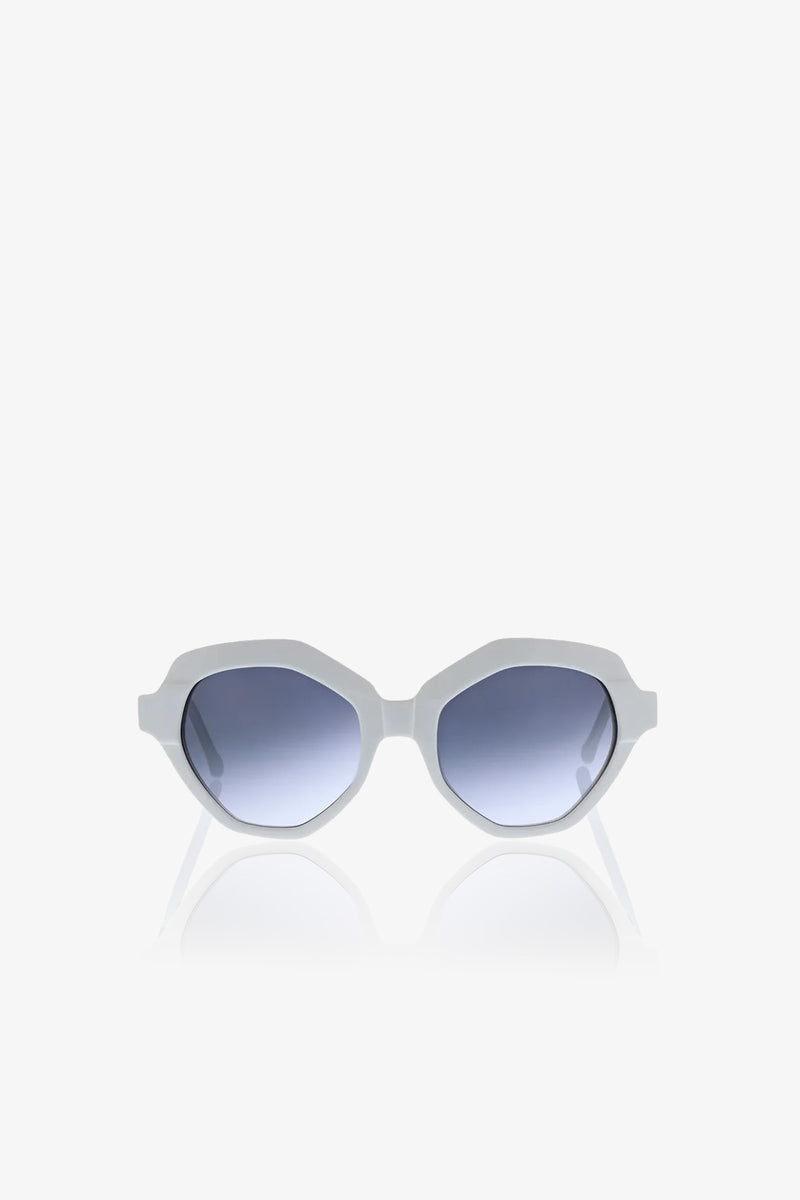The Ipanema Sunglasses feature white geometric, angular frames and blue gradient lenses, showcased against a plain white background.