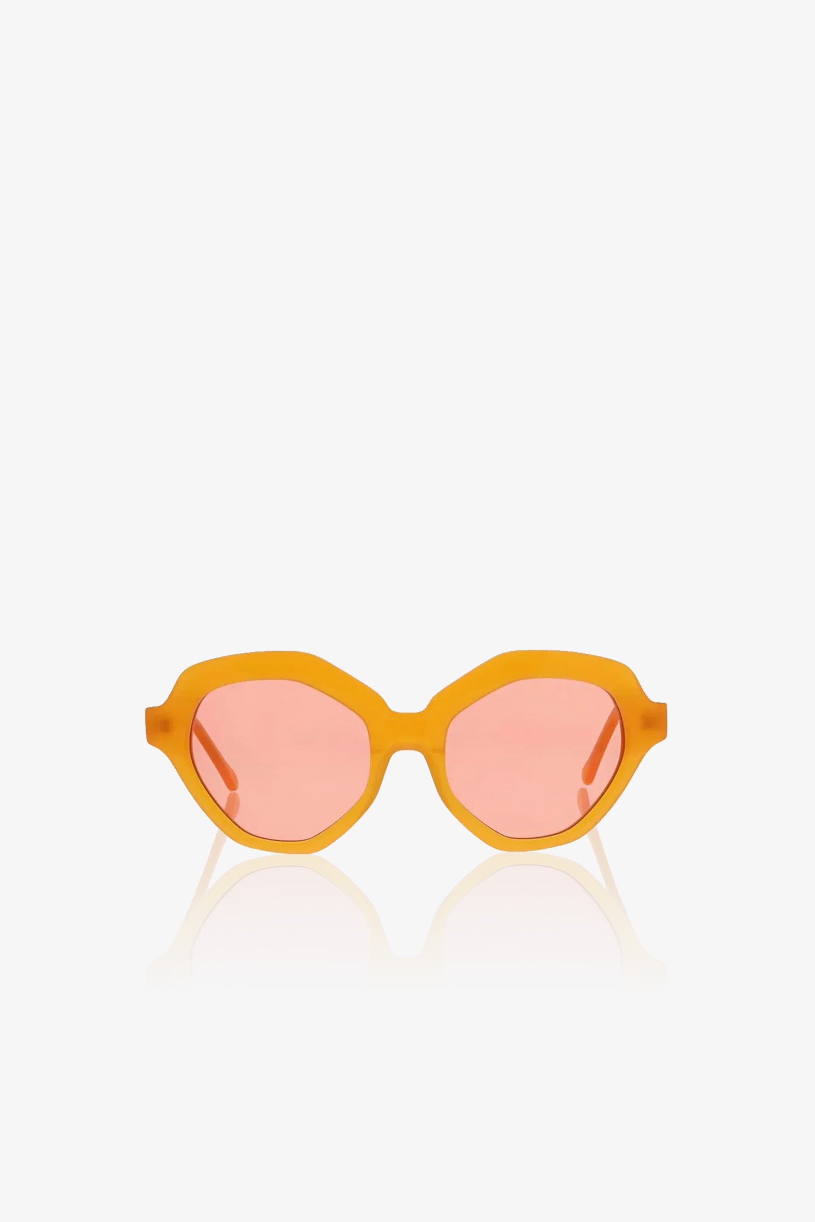 Ipanema Sunglasses with thick orange frames and pink-tinted oval lenses, displayed on a white background.