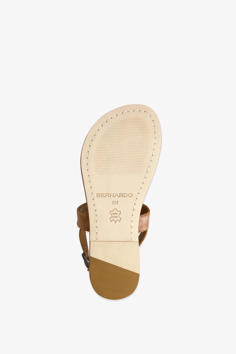 A tan leather Maverick 2 Sandal is shown from the bottom, displaying the sole with the Bernardo brand name, a leather symbol, and size marking 6M. The heel and stitching details are clearly visible.