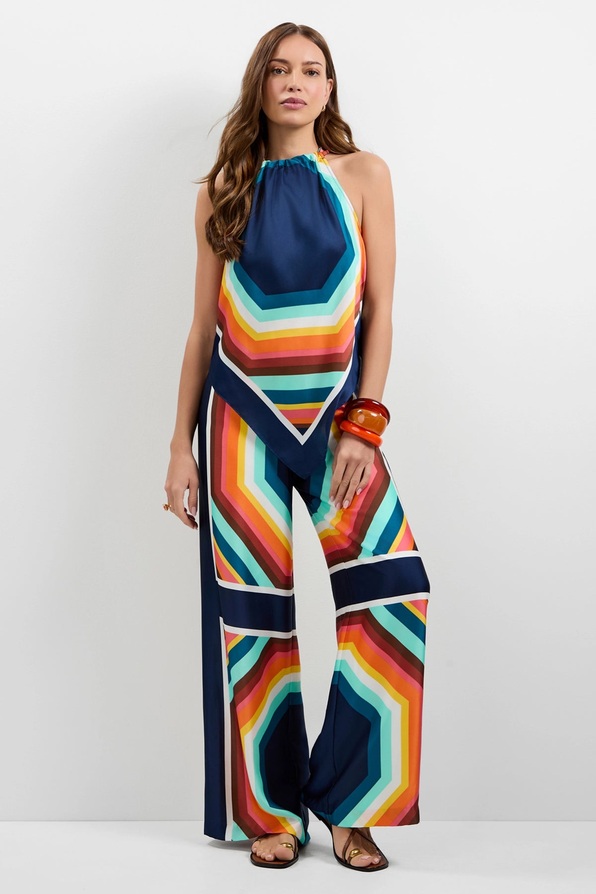 A woman wearing the Lavani Halter Neck Top.