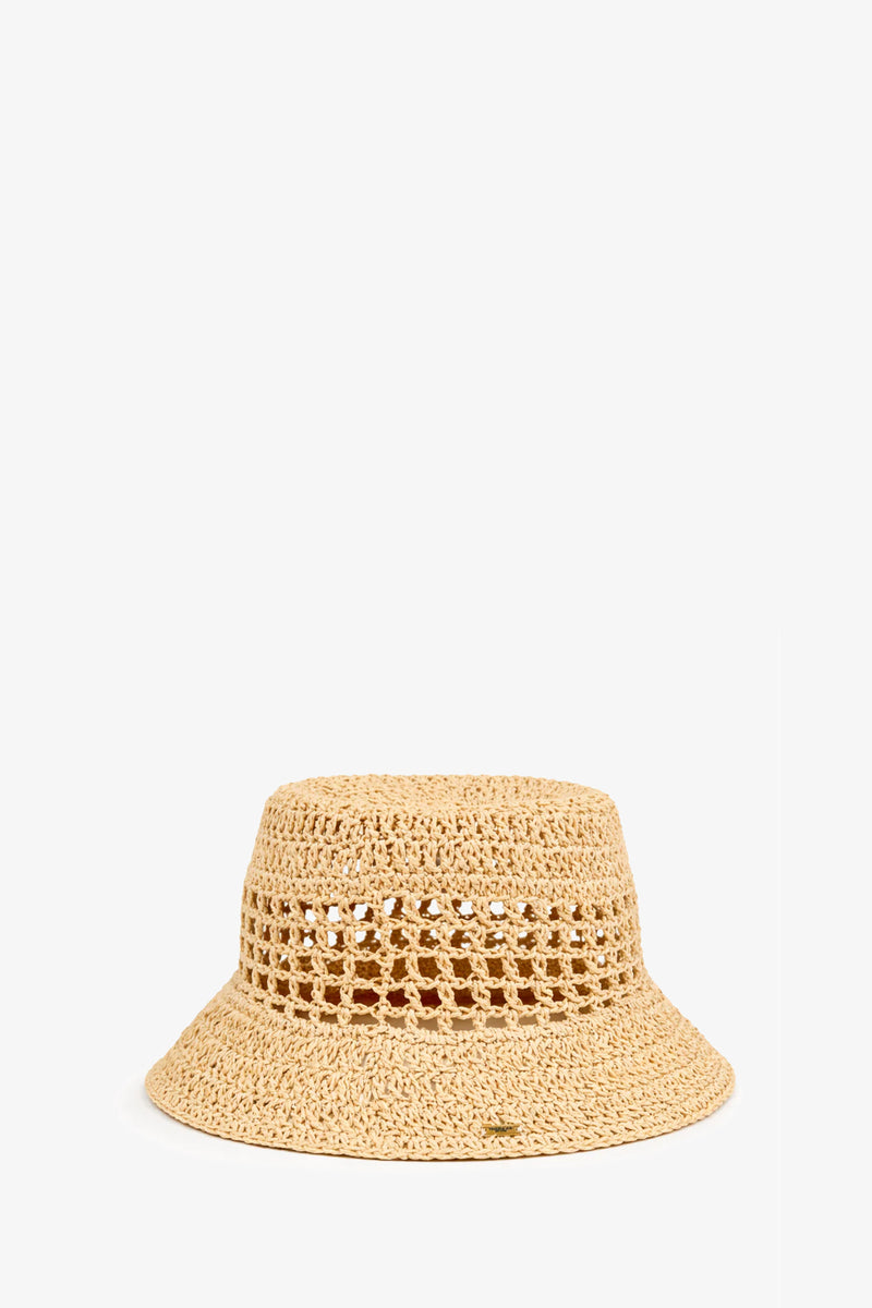 The Jonah Hat, in a natural hue, is a crochet bucket hat crafted from woven straw with a wide brim and openwork pattern around the crown, shown against a plain white background.