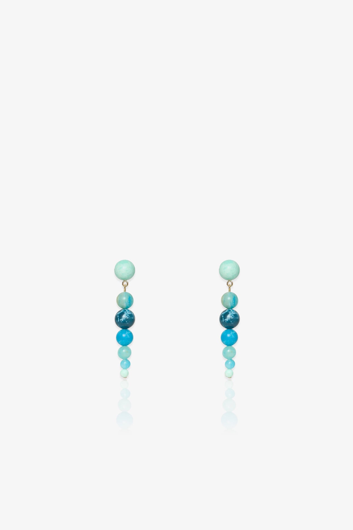 Introducing the Riviera Linear Drop Earrings: a pair of drop earrings featuring four round beads each, arranged vertically in gradient shades of blue against a white background.
