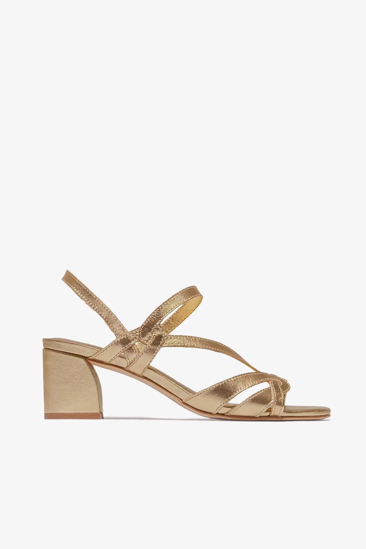 Gyoda Heeled Sandal in gold, featuring strappy design, a low block heel, and open toe, shown in profile against a plain white background.