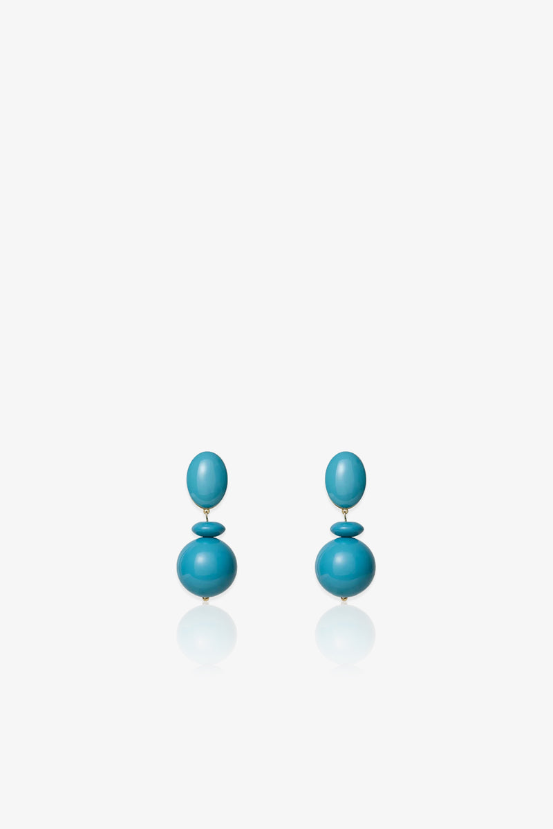 Aventura Drop Earrings in turquoise blue, featuring two stacked round beads on each earring, displayed against a plain white background.