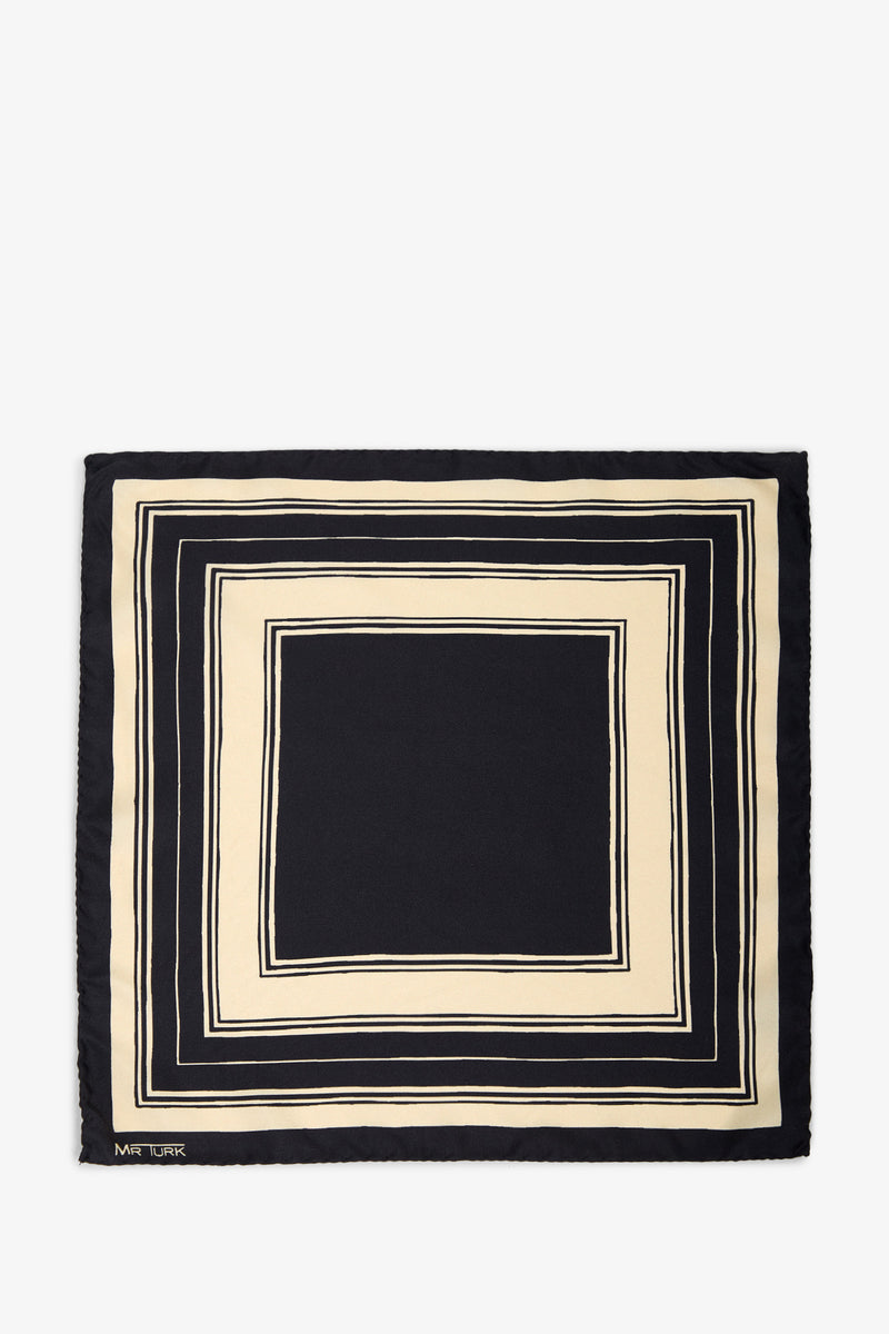 A minimalist and modern Pocket Square crafted from silk, featuring a black center and cream-colored geometric borders in concentric squares with alternating thin and thick lines.